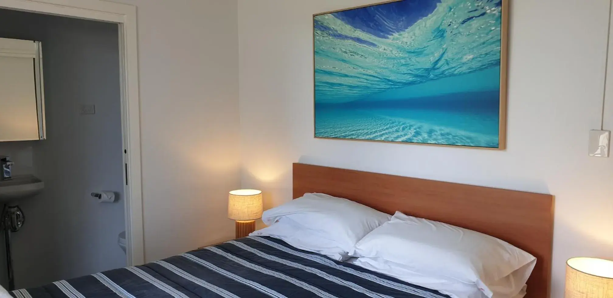 Bed in Wyuna Beachfront Holiday Apartments