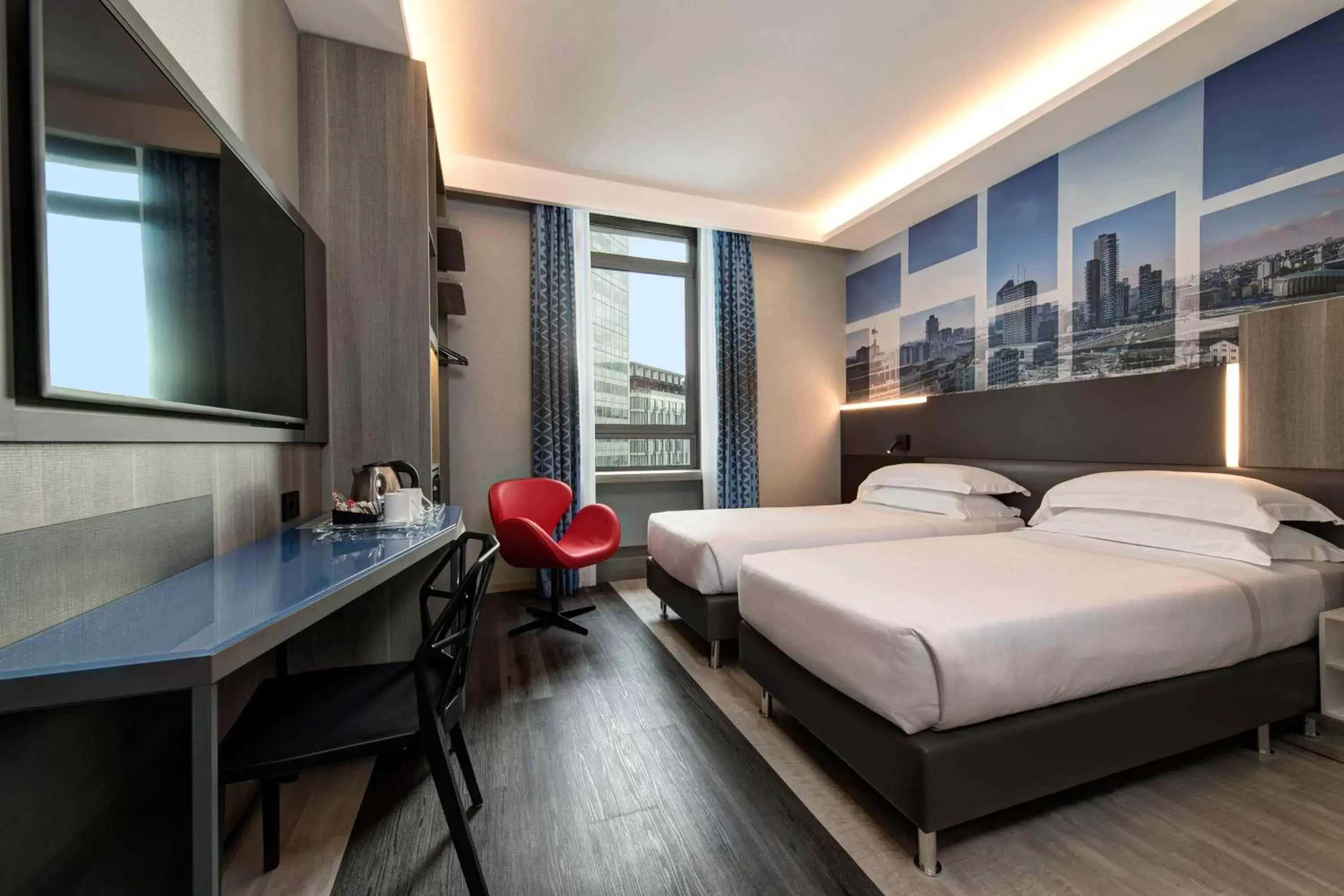 Bed in iQ Hotel Milano