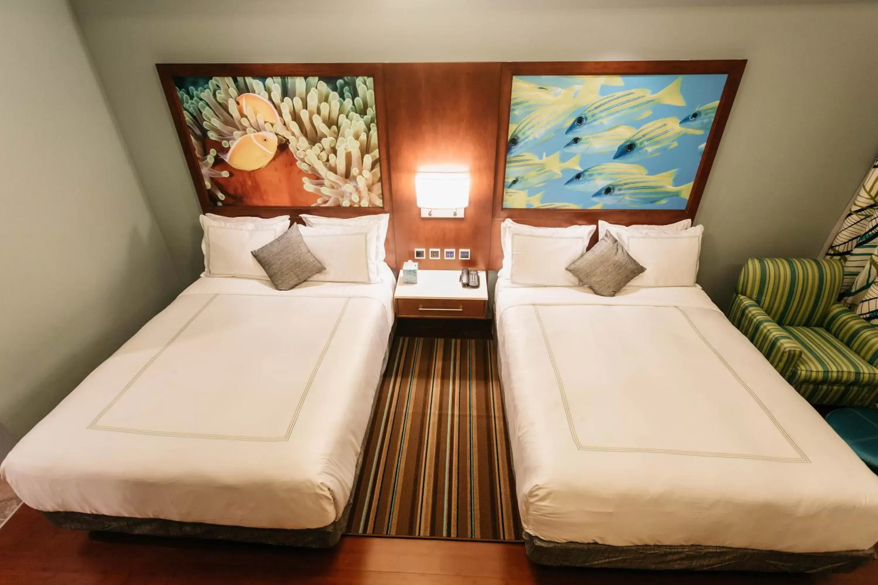 Bed in Surfrider Resort Hotel