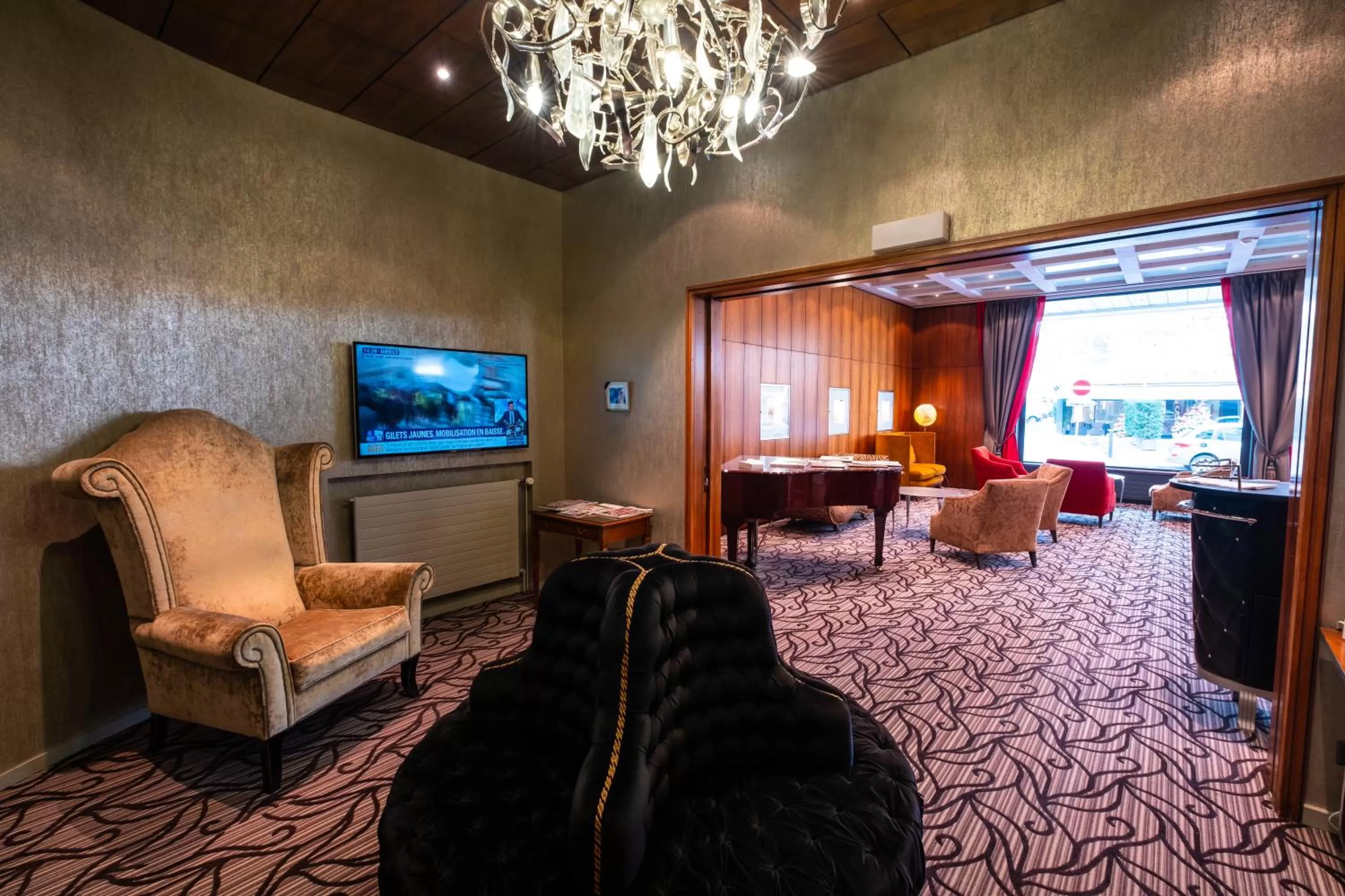 Communal lounge/ TV room in The Ambassador