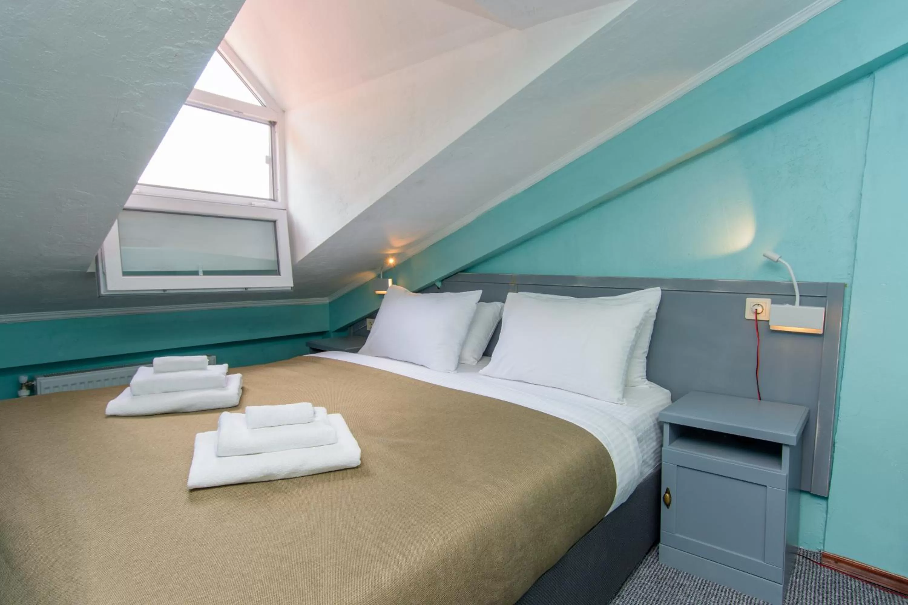 Bed in Kindli Boutique Hotel