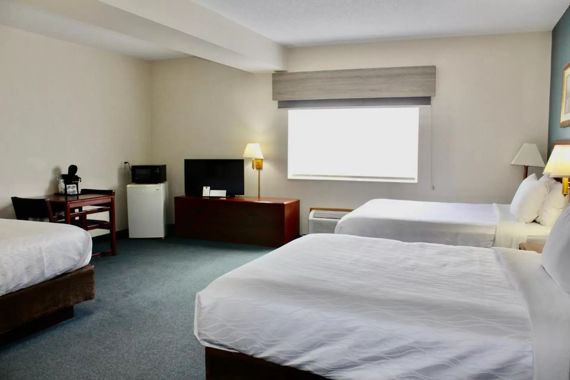 Bed in Reston Inn & Suites