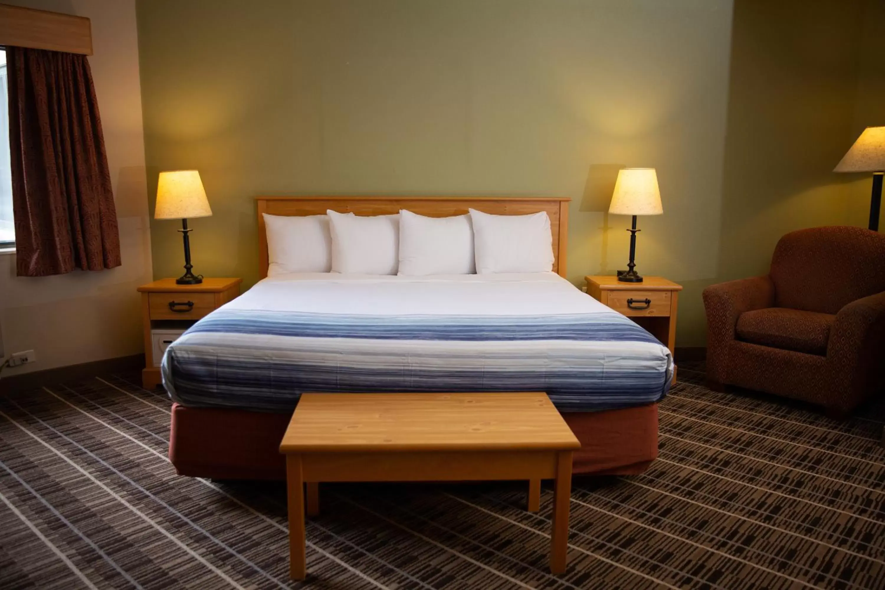 Bed in AmericInn by Wyndham Pampa Event Center