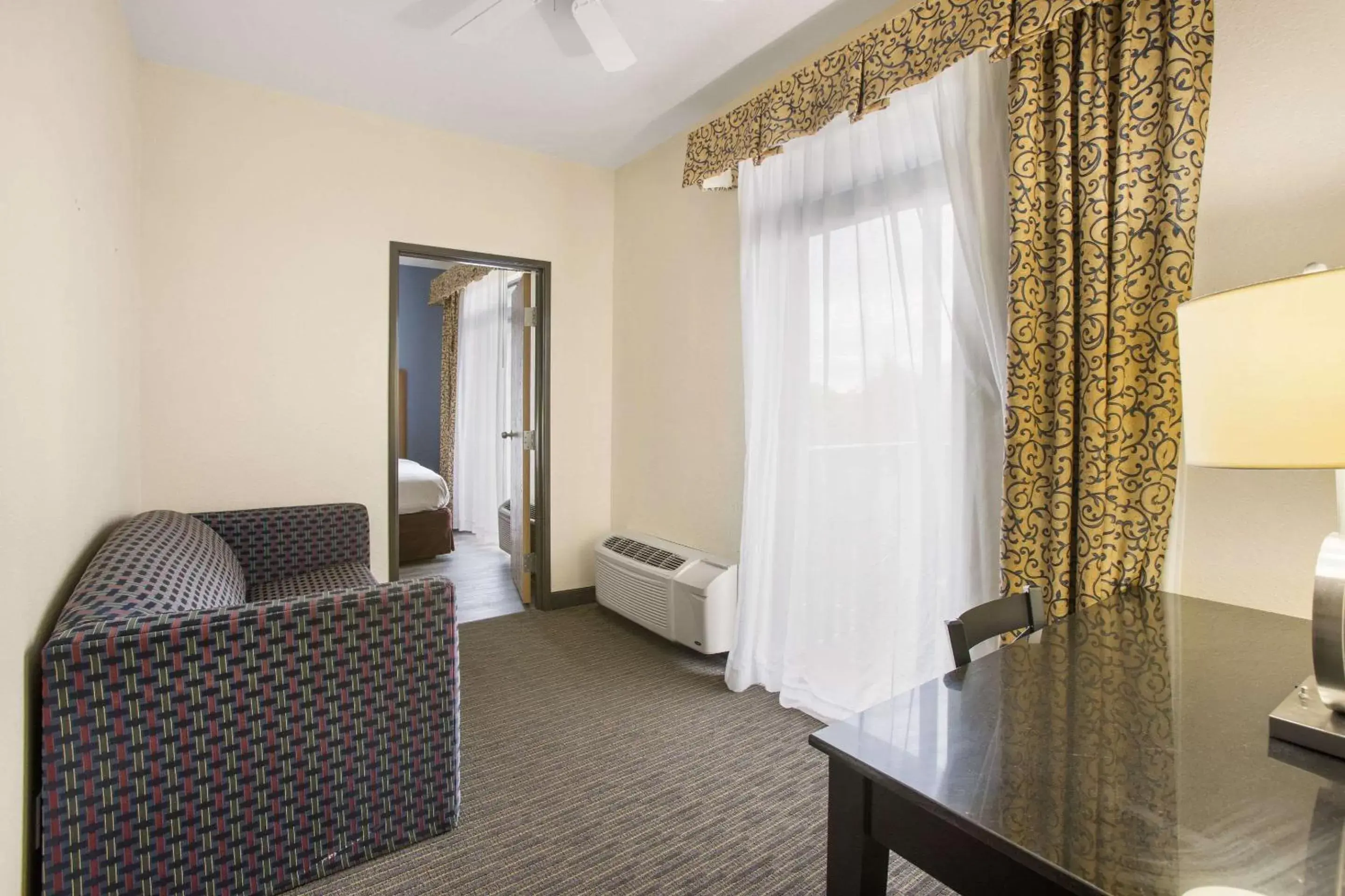 Photo of the whole room, Seating Area in Rodeway Inn & Suites Mackinaw City Bridgeview