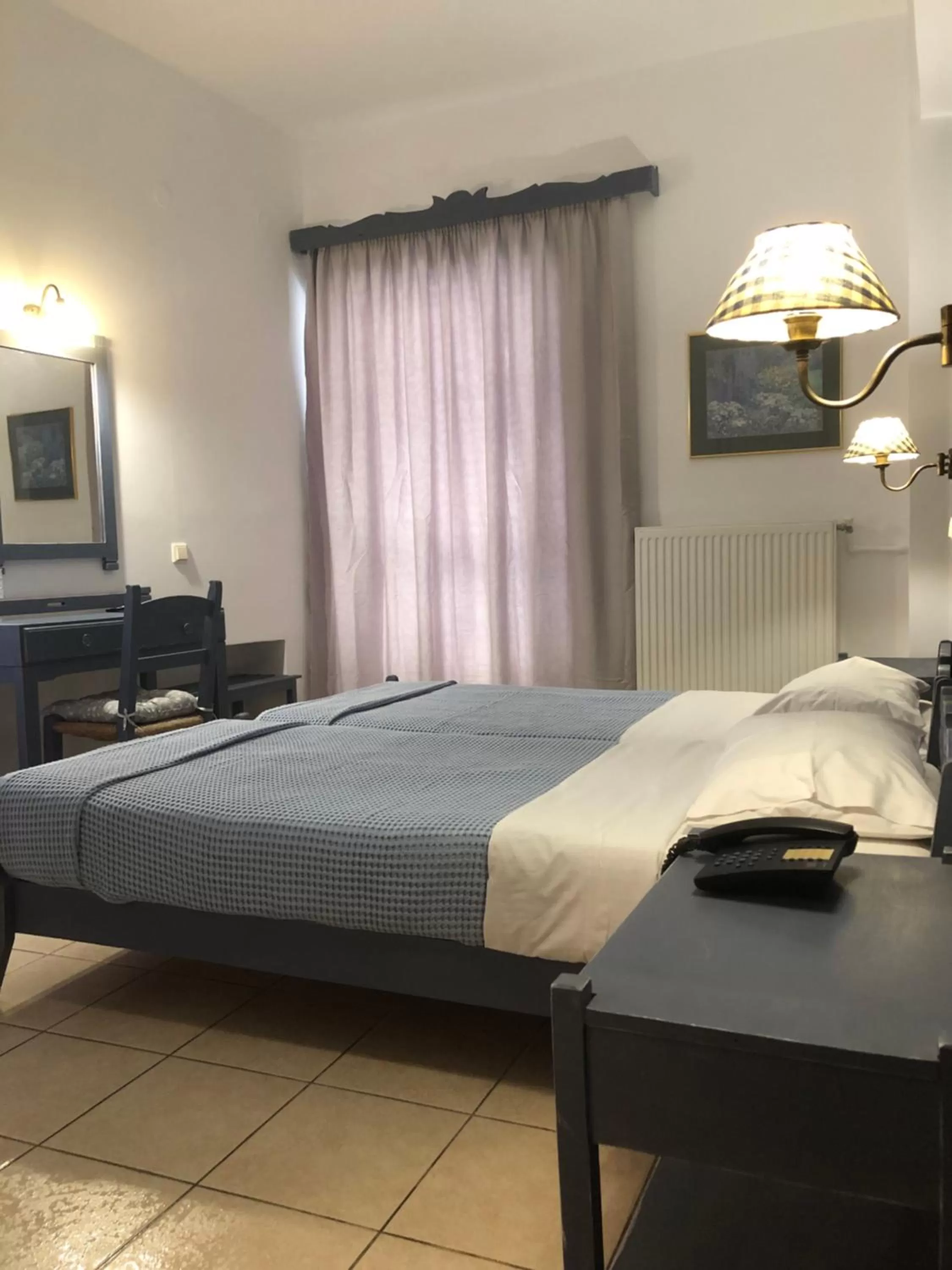 Bed in Ikaros Art Hotel