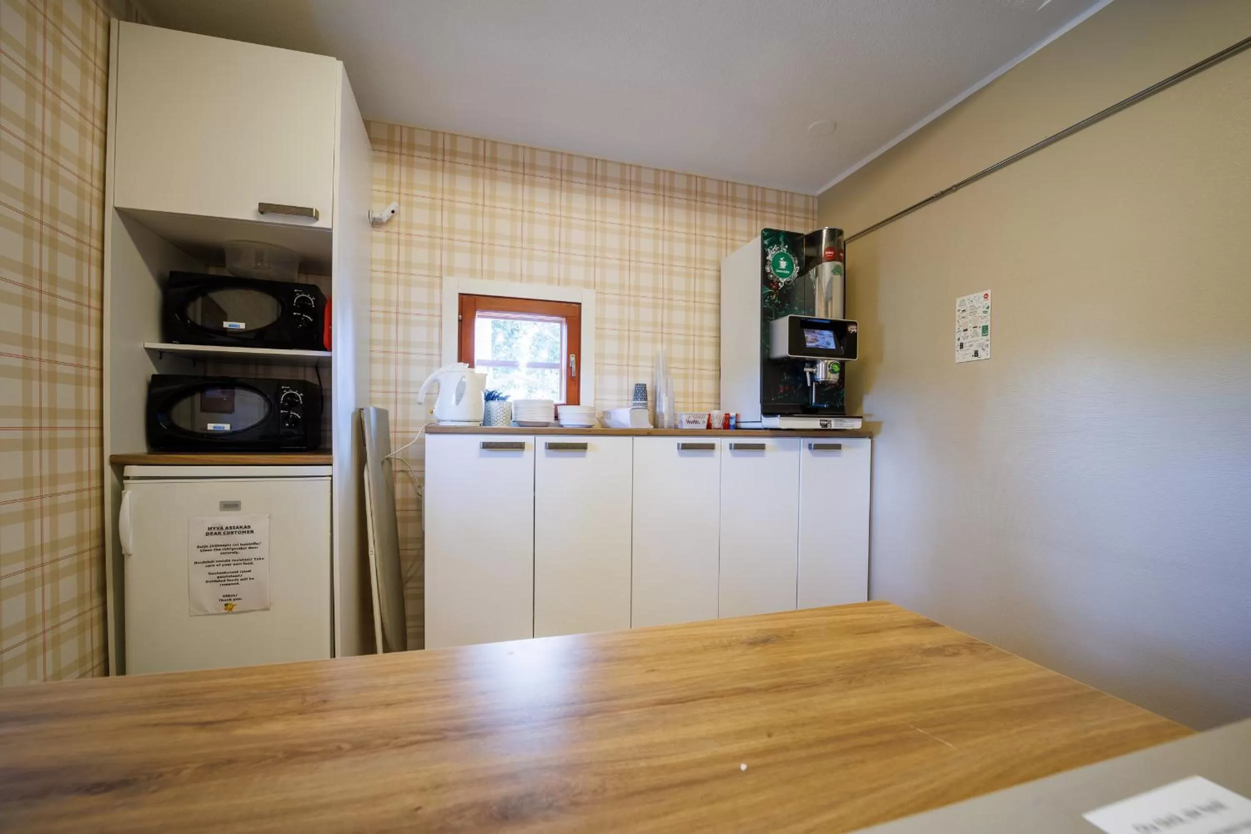 Kitchen or kitchenette in Hotelli Uninen Tampere