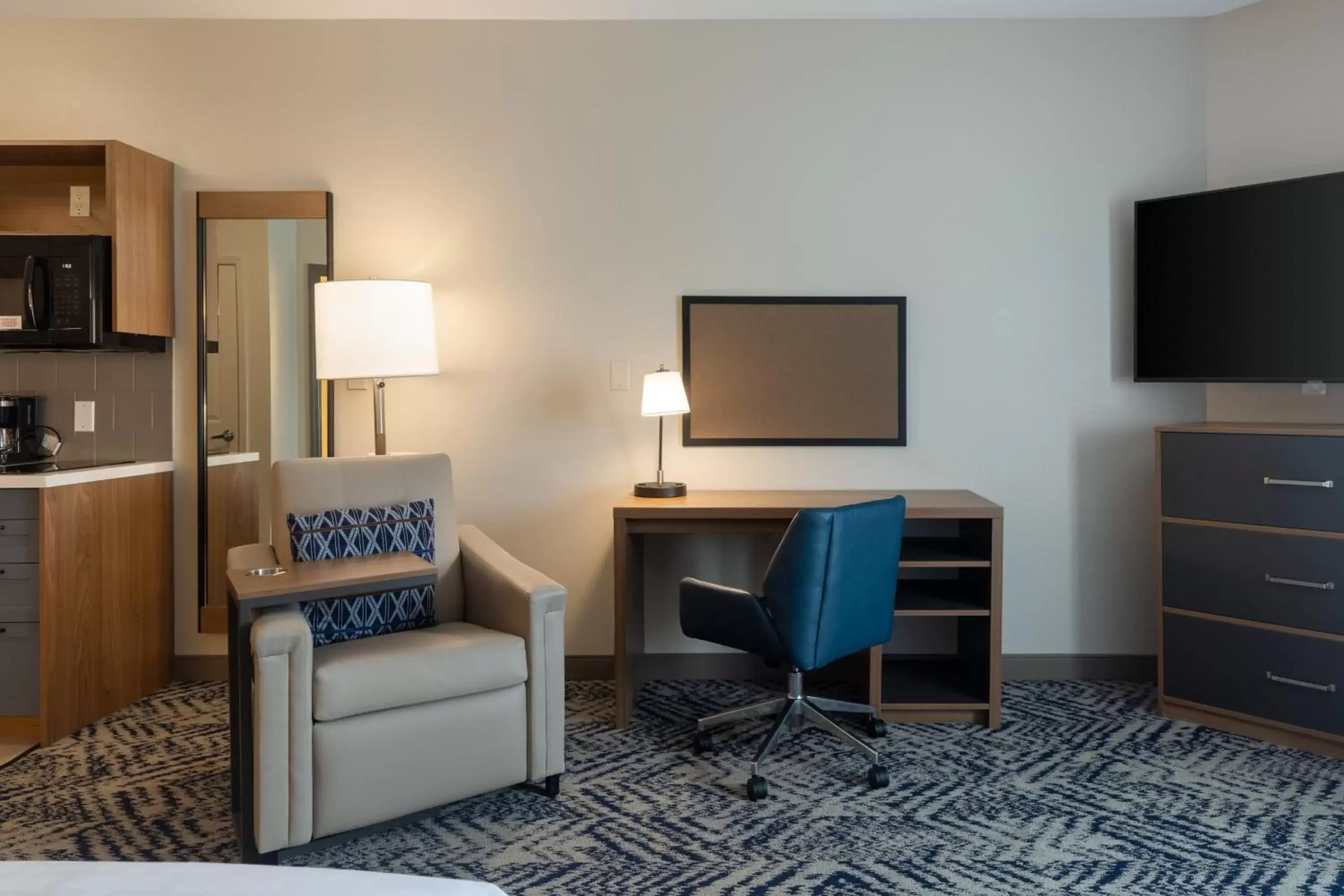 Photo of the whole room, TV/Entertainment Center in Candlewood Suites Enterprise, an IHG Hotel
