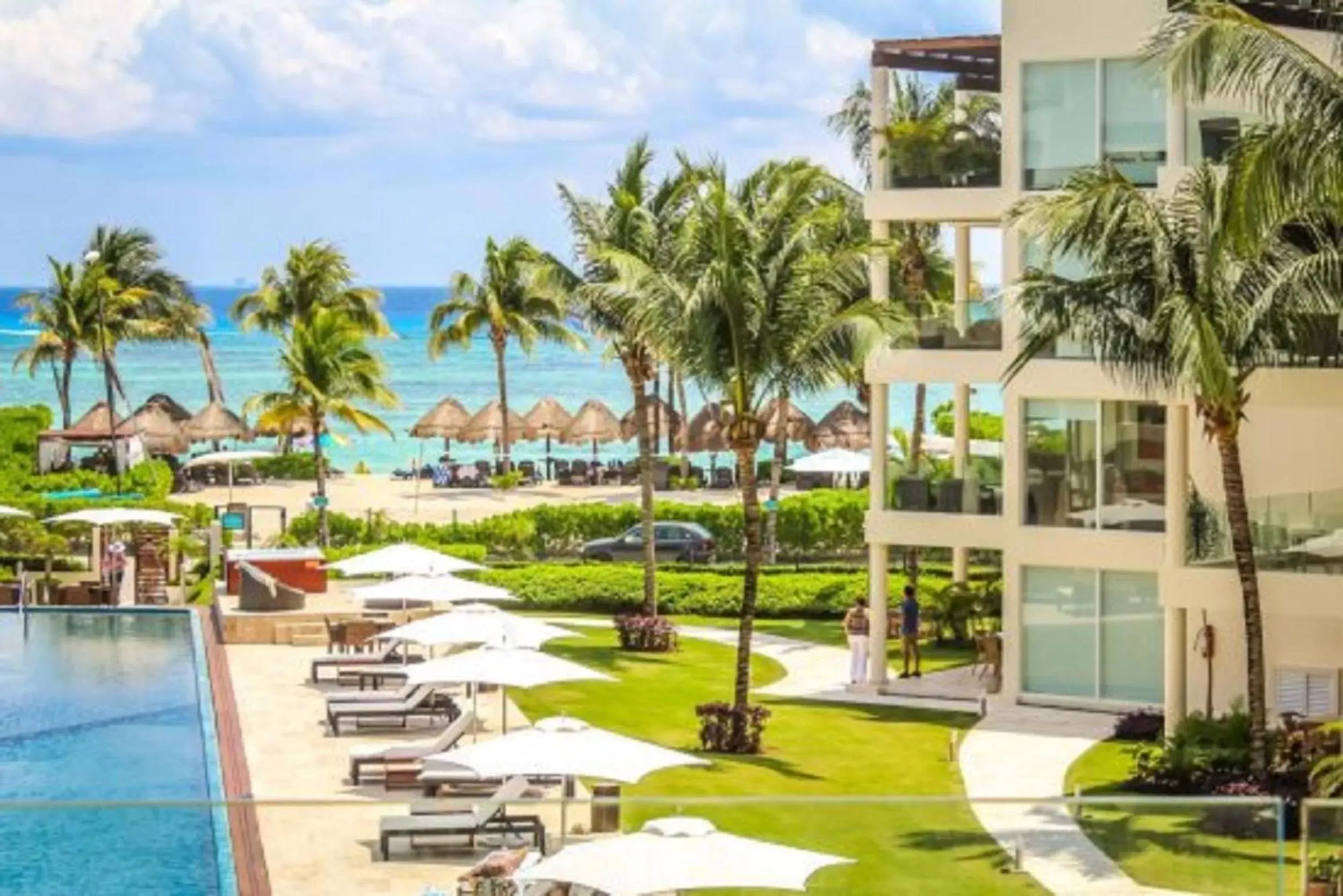 Balcony/Terrace, Pool View in The Elements Oceanfront & Beachside Condo Hotel