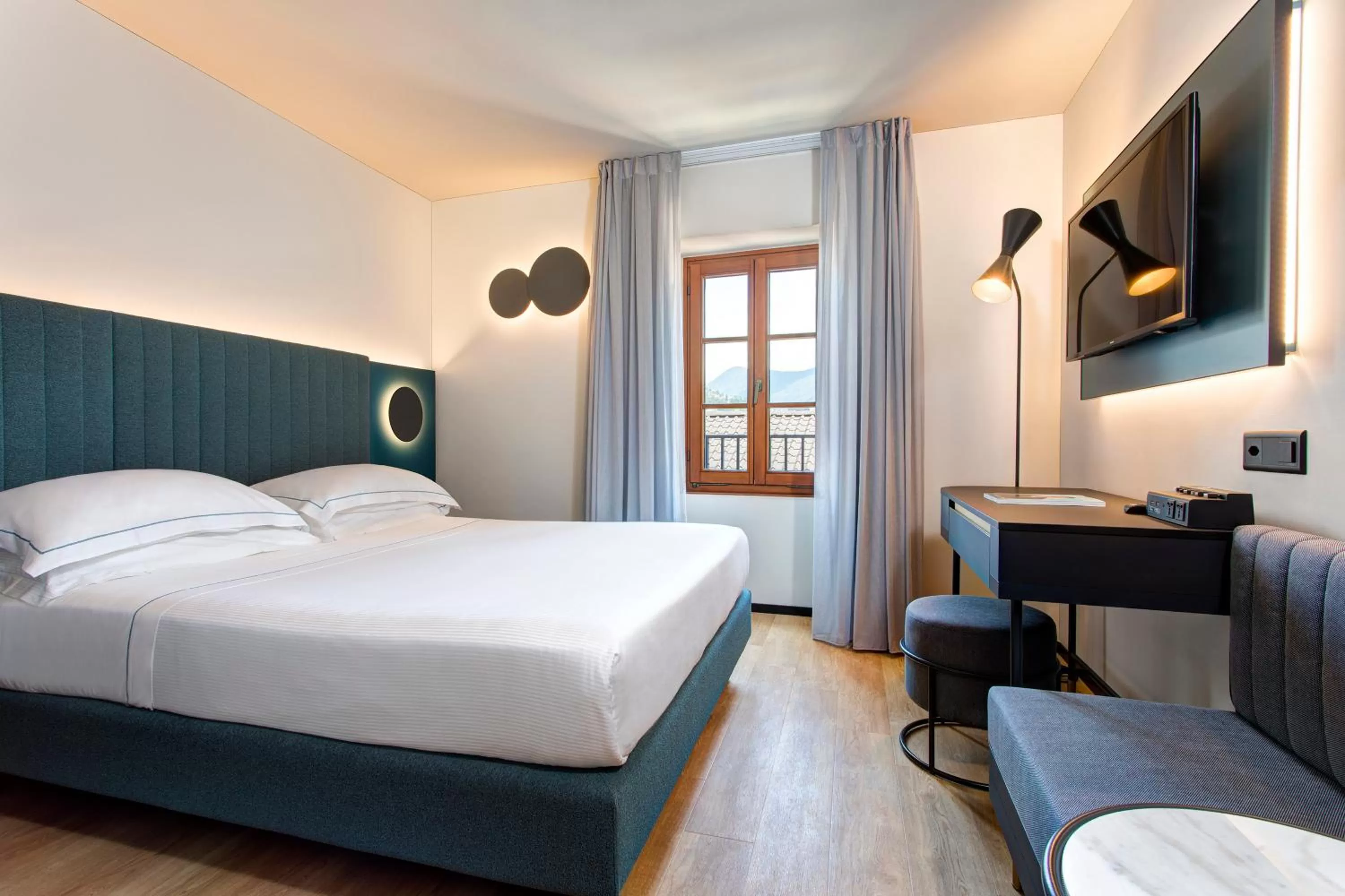 Bed in LUGANODANTE Boutique & Lifestyle Hotel