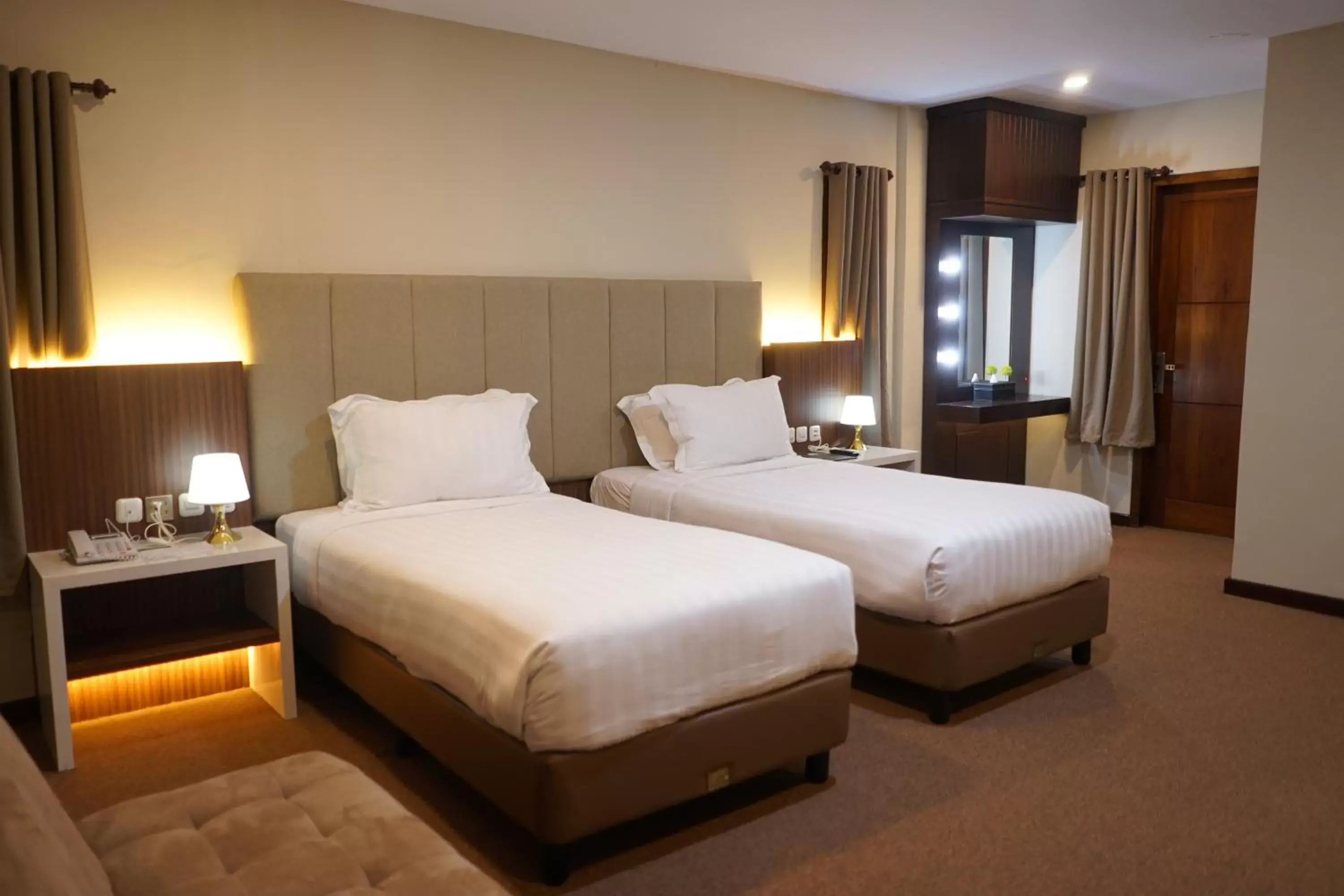 Bed in Grand Harvest Resort & Villas