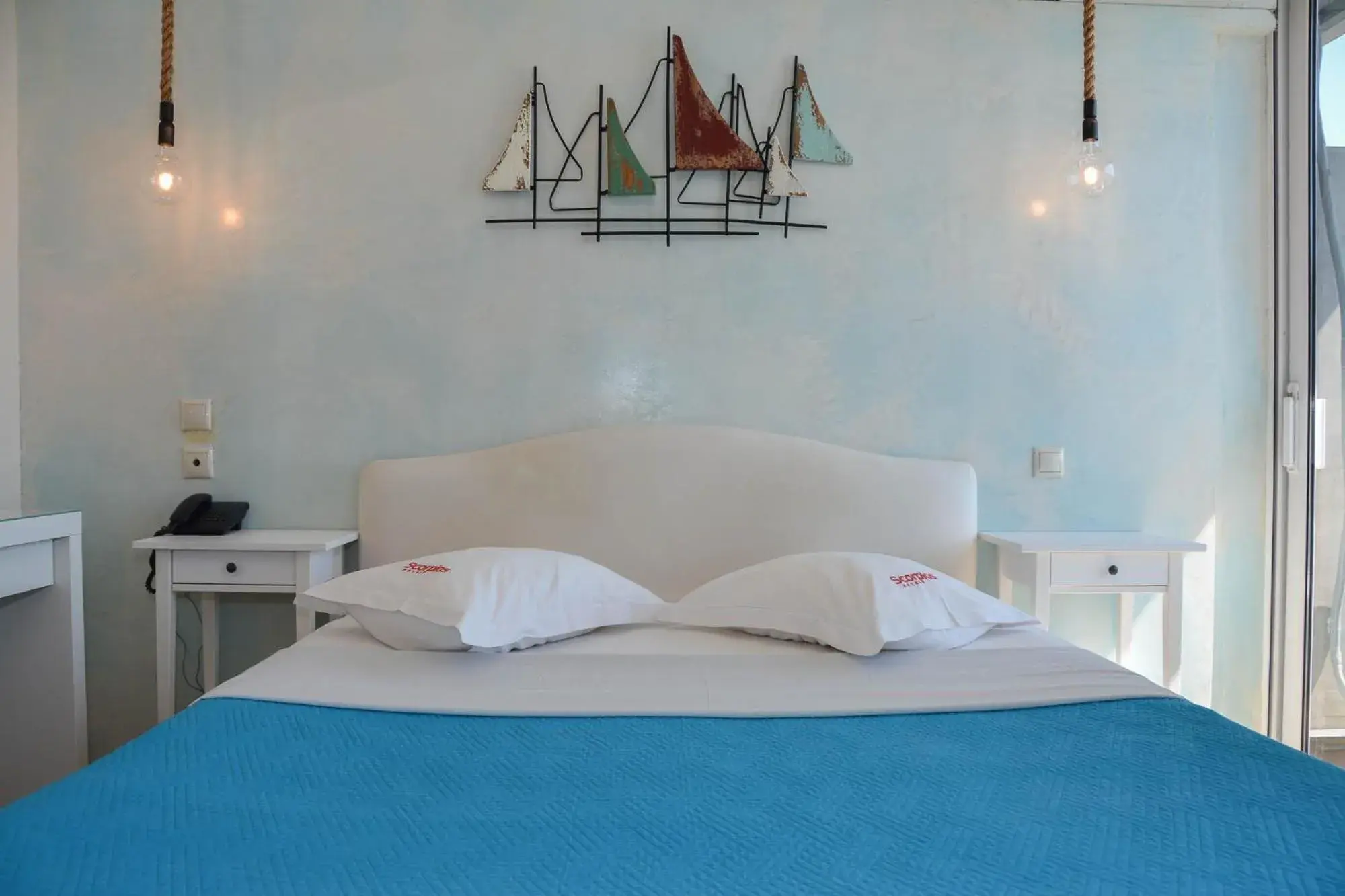 Bed in Scorpios Sea Side Hotel