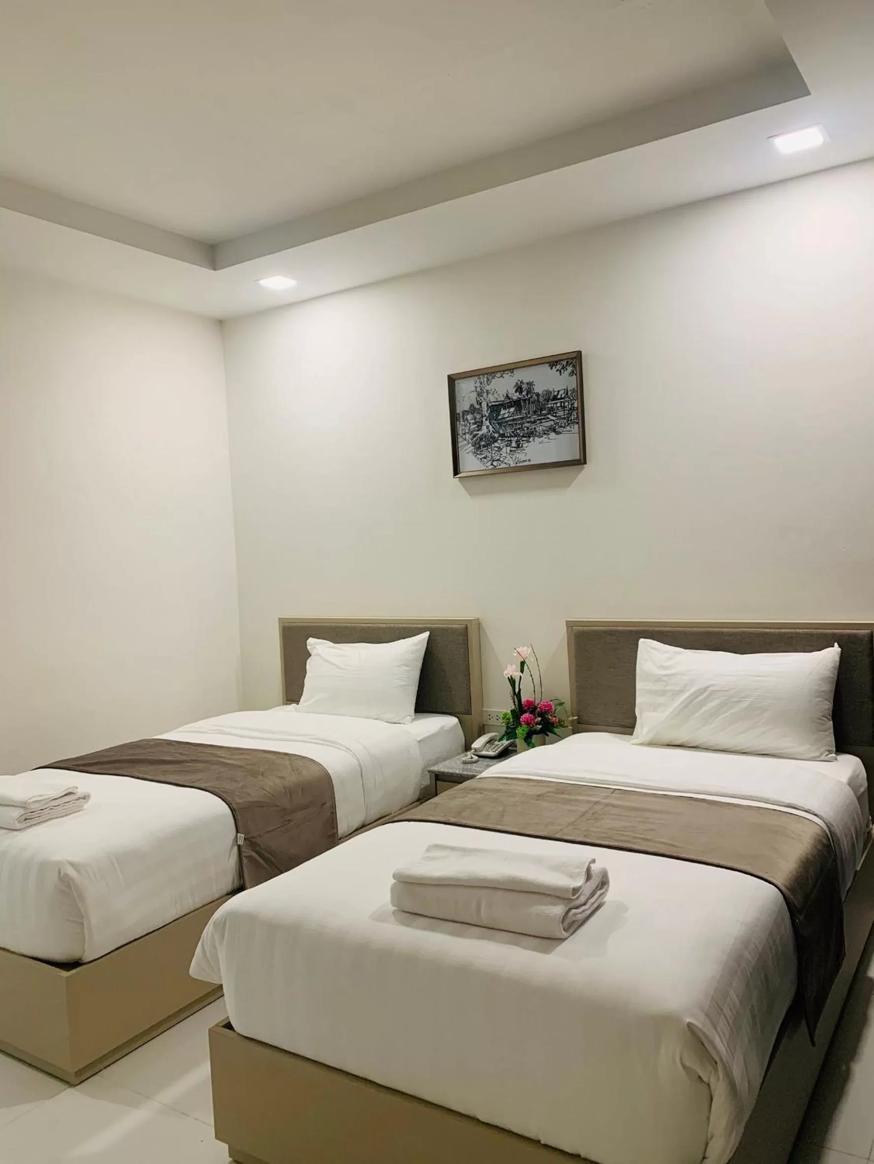 Bed in Icare Residence & Hotel