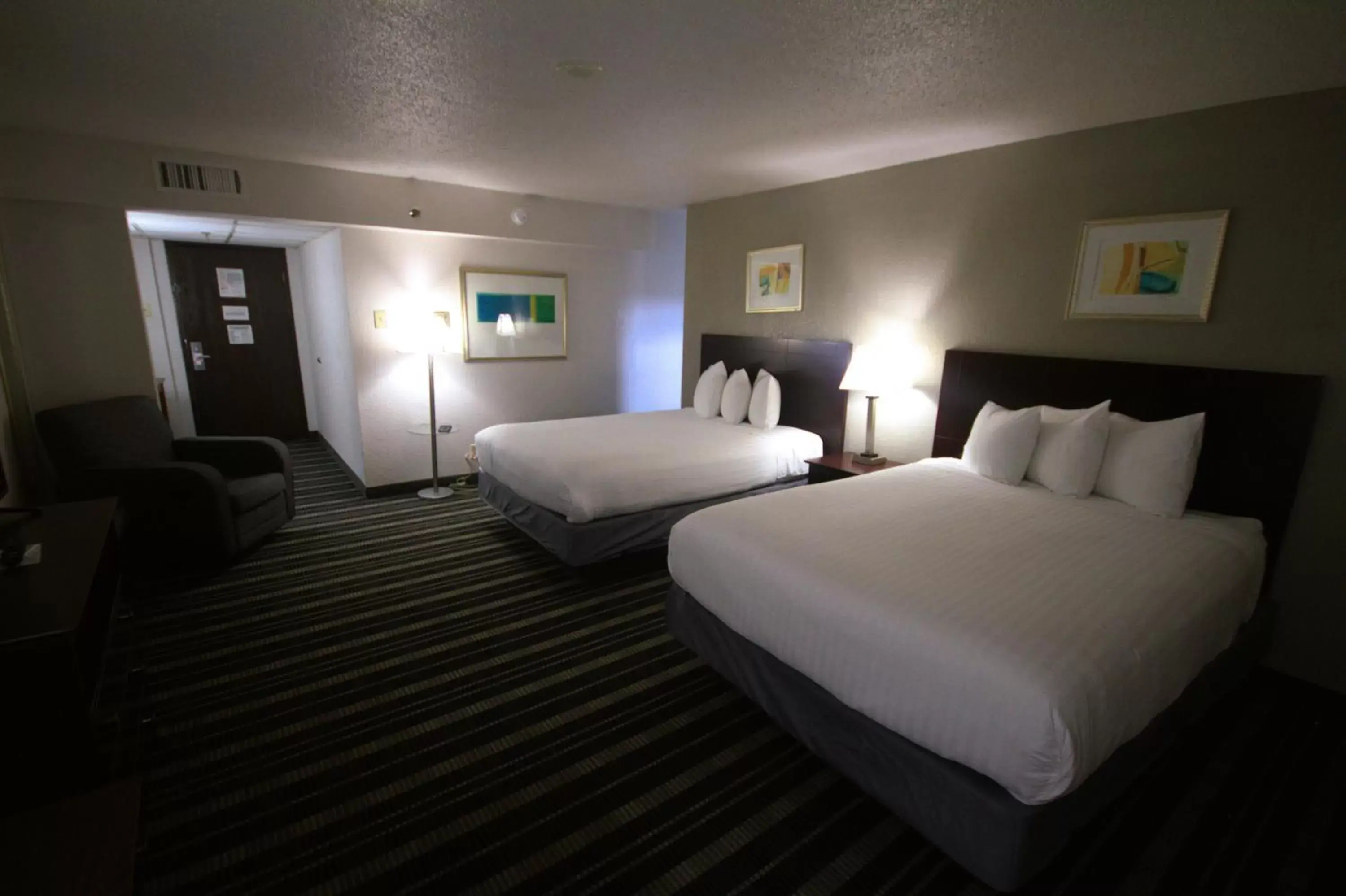 Bedroom, Bed in Atrium Hotel and Suites DFW Airport