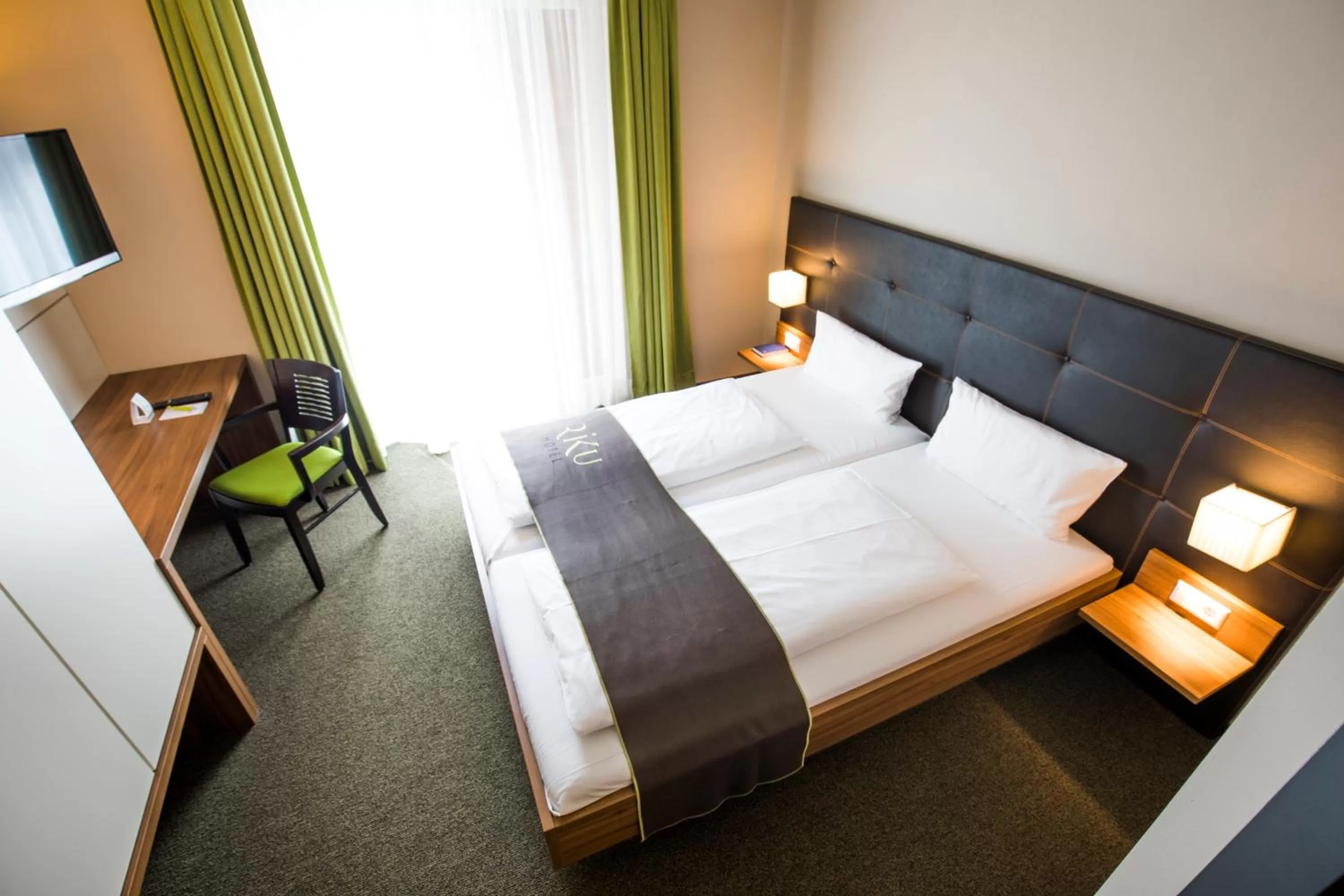 Photo of the whole room, Bed in RiKu HOTEL Weißenhorn