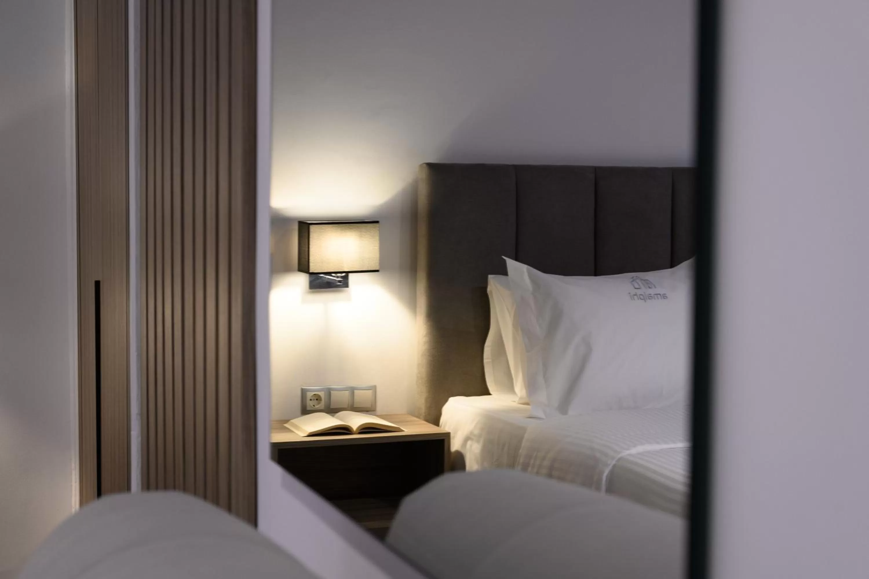 Bed in AMALPHI Corfu City Living