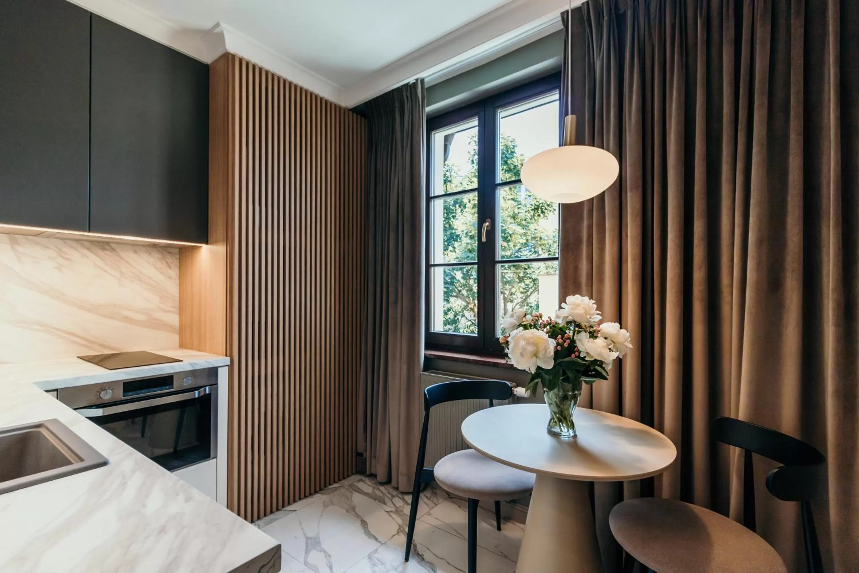 Kitchen or kitchenette, Bed in Apartamenty Małe Garbary