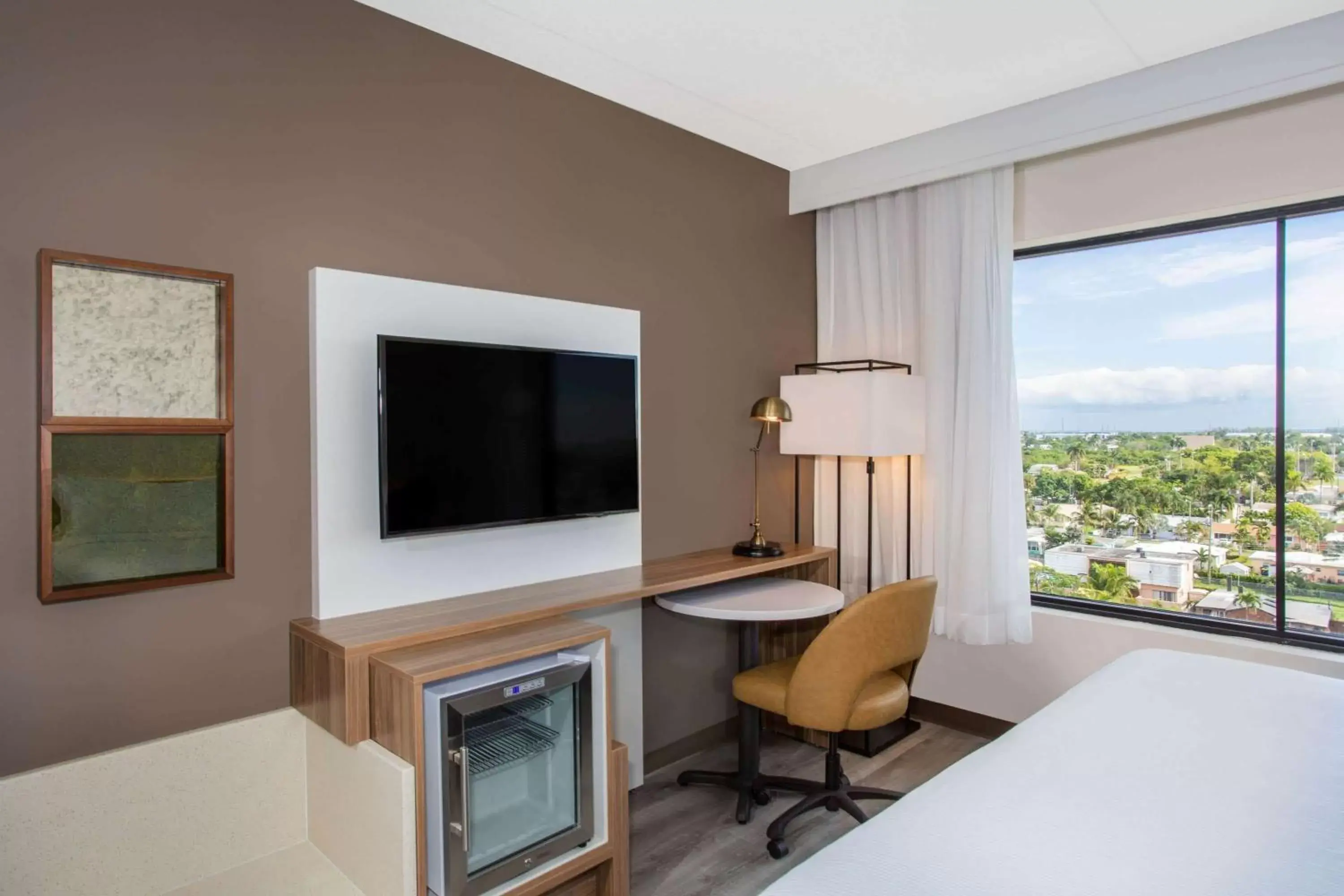 Photo of the whole room, TV/Entertainment Center in Wyndham Garden Ft Lauderdale Airport & Cruise Port