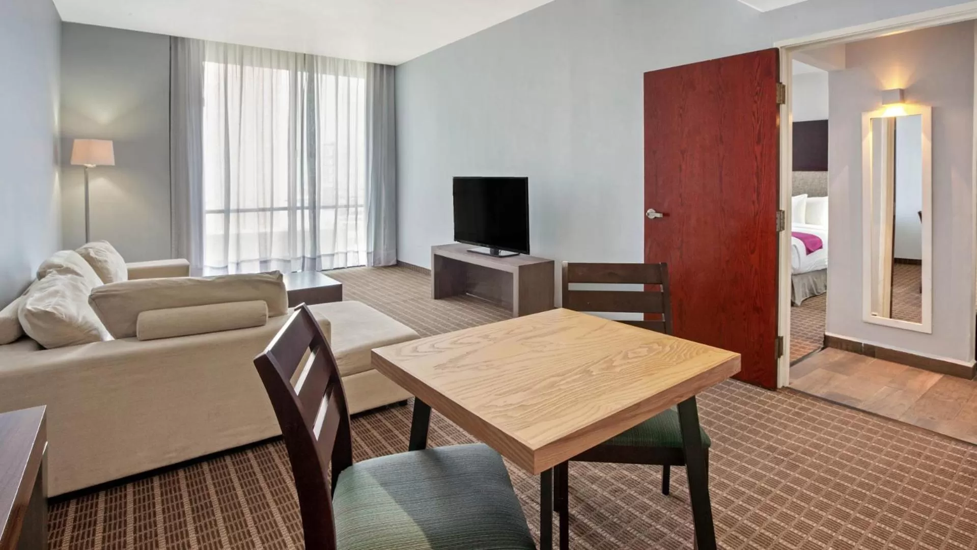 Communal lounge/ TV room in CHN Hotel Monterrey Centro, Trademark Collection by Wyndham