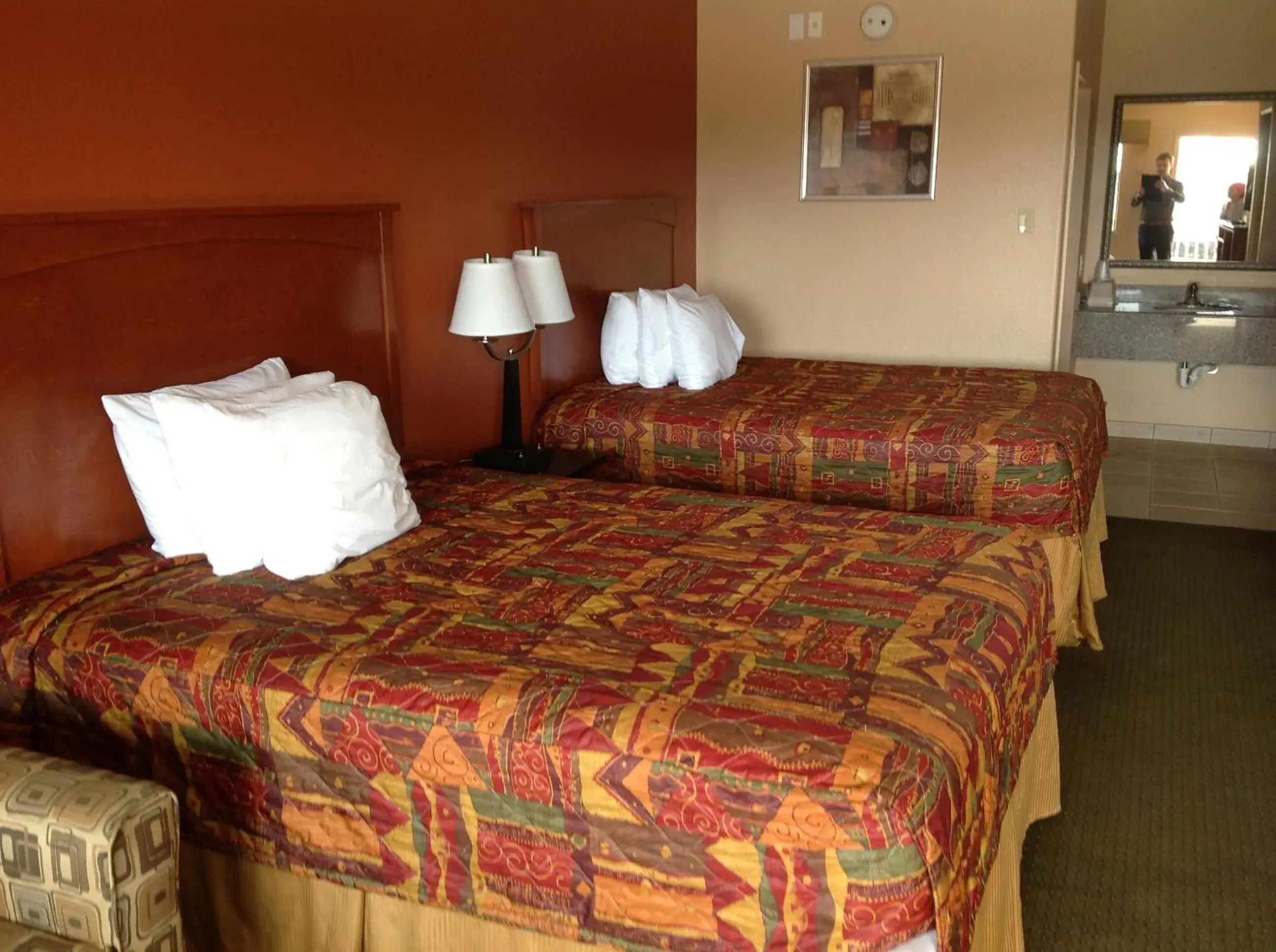 Bed in Budgetel Inn and Suites