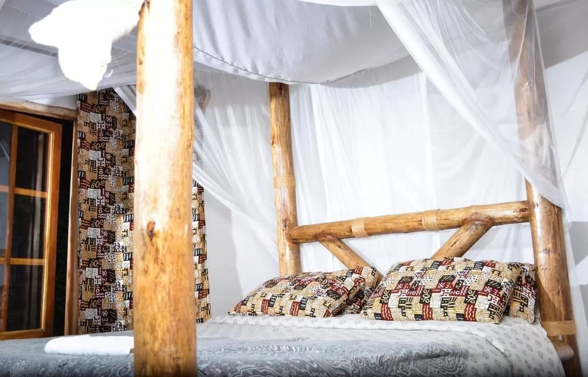 Bed in Charming Eco-Homestay near Kilimanjaro International Airport