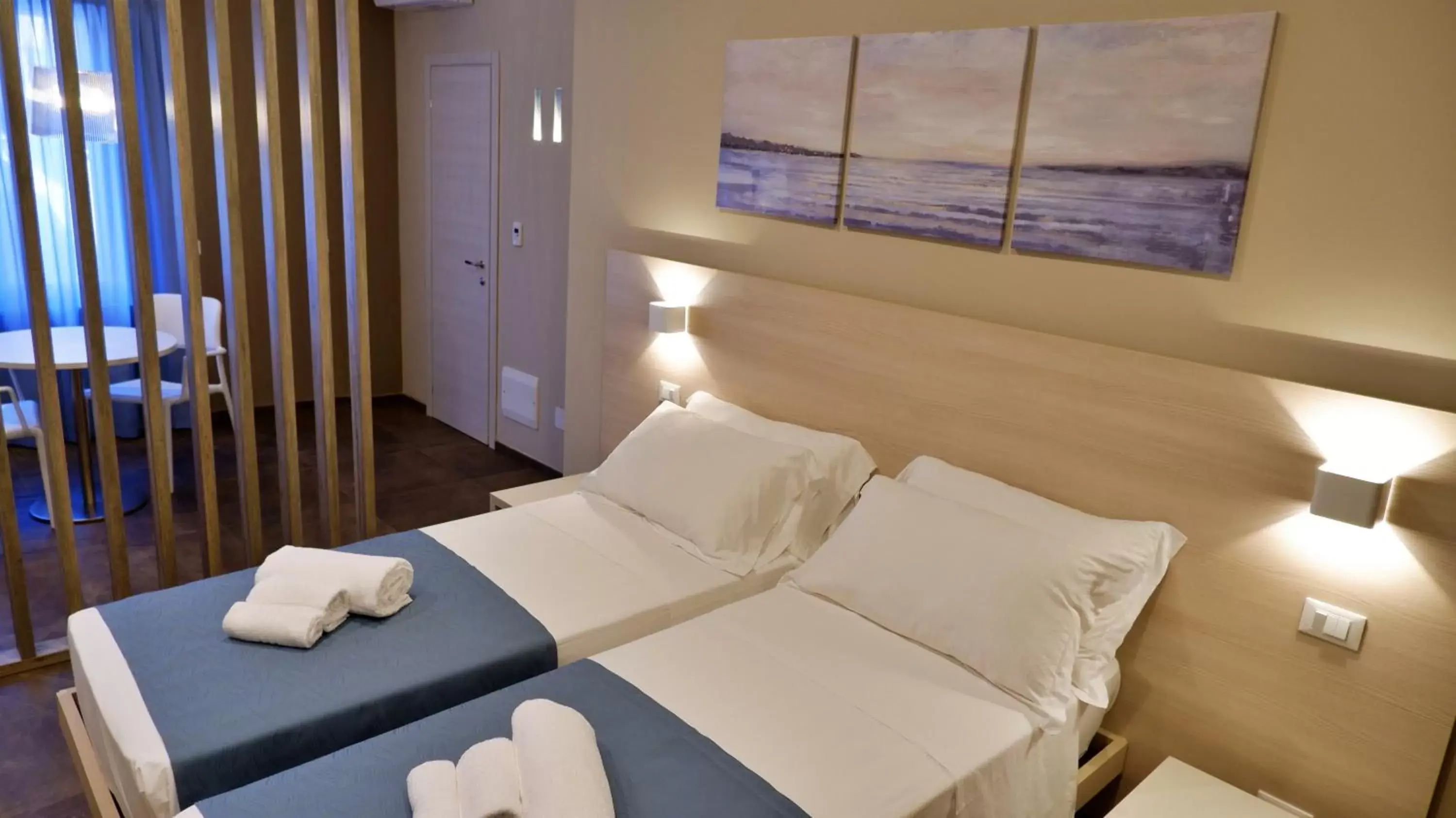 Bed in Pianomare Riviera Apartments and Rooms