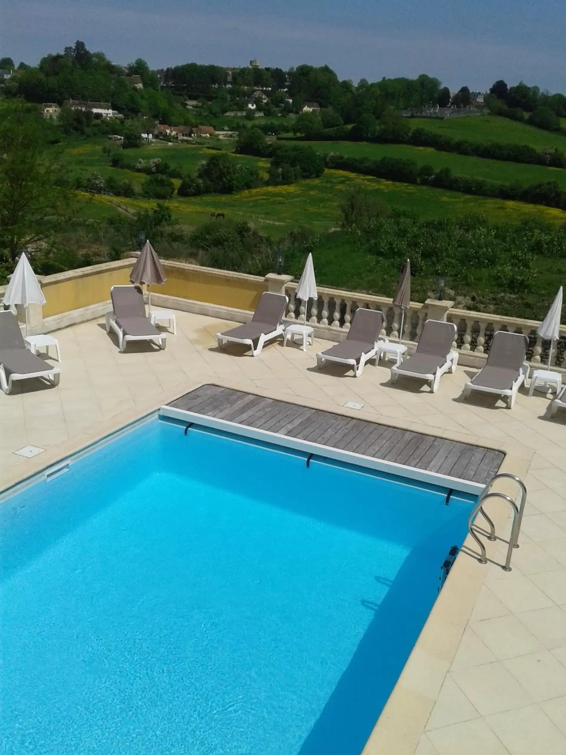 Swimming pool, Pool View in Hôtel Résidence Normandy Country Club by Popinns