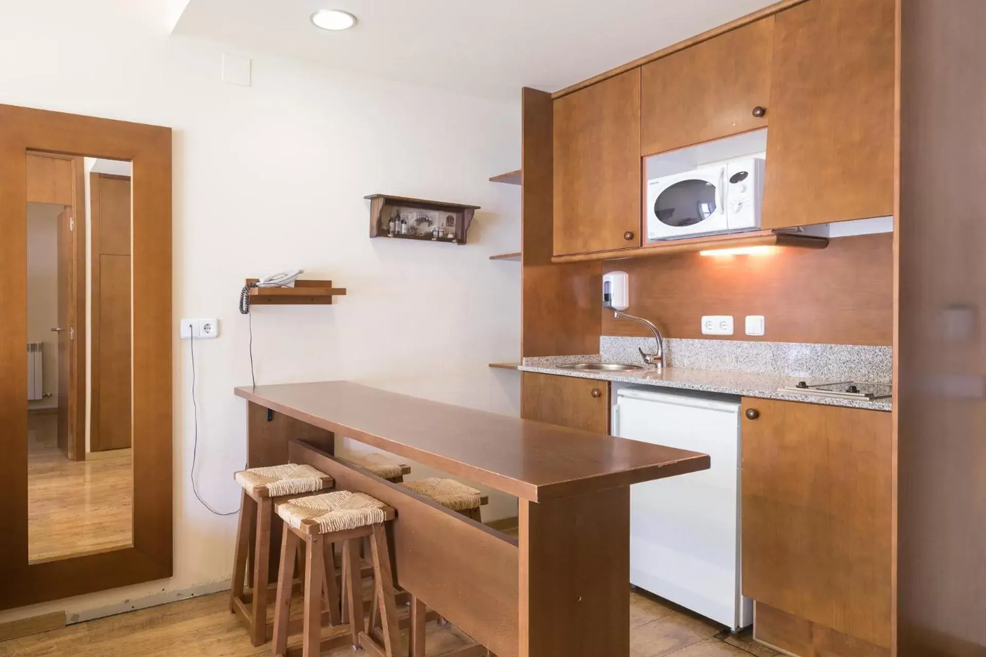 Kitchen or kitchenette in Aparthotel La Vall Blanca