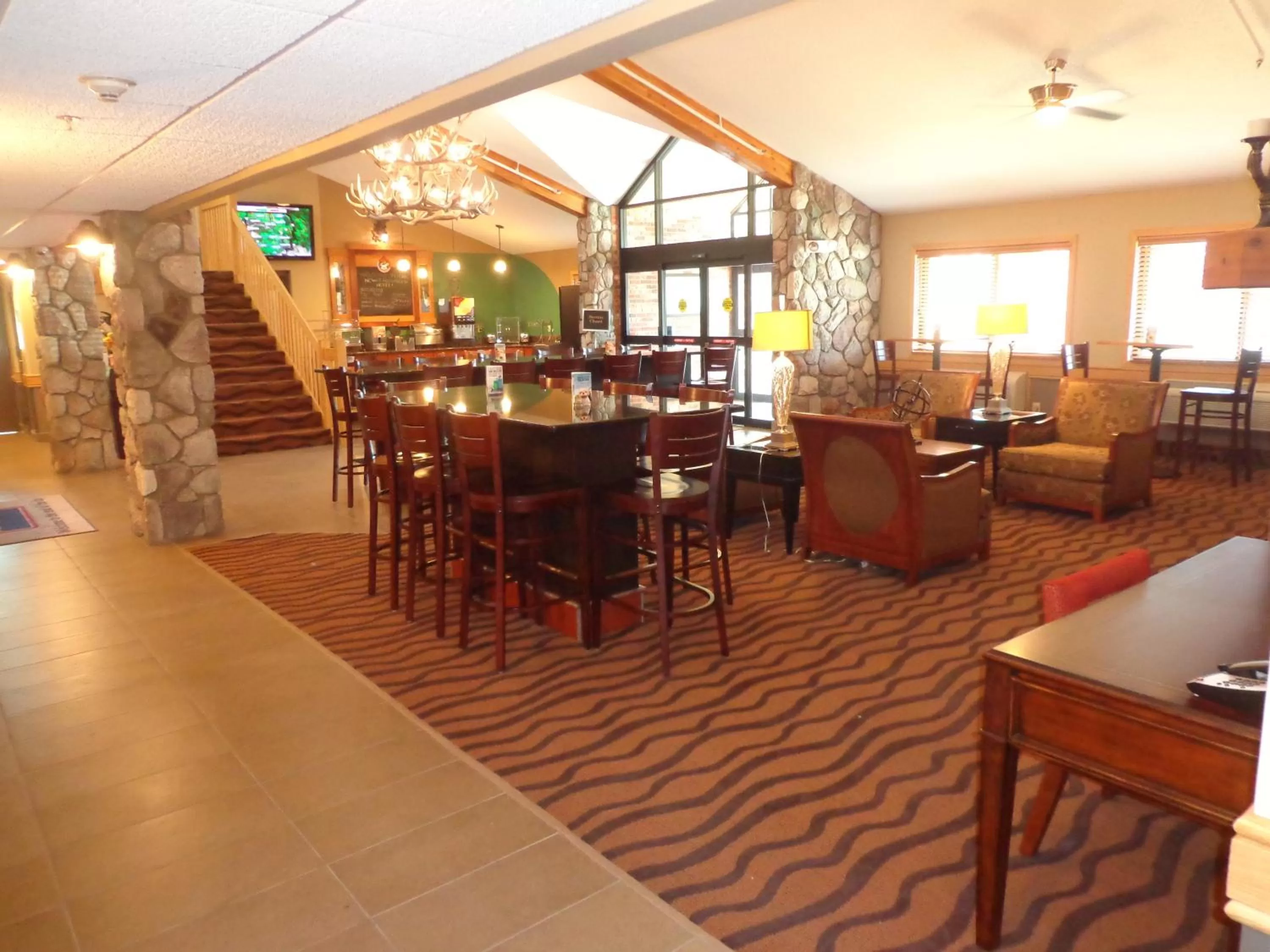 Living room in AmericInn by Wyndham Grand Forks