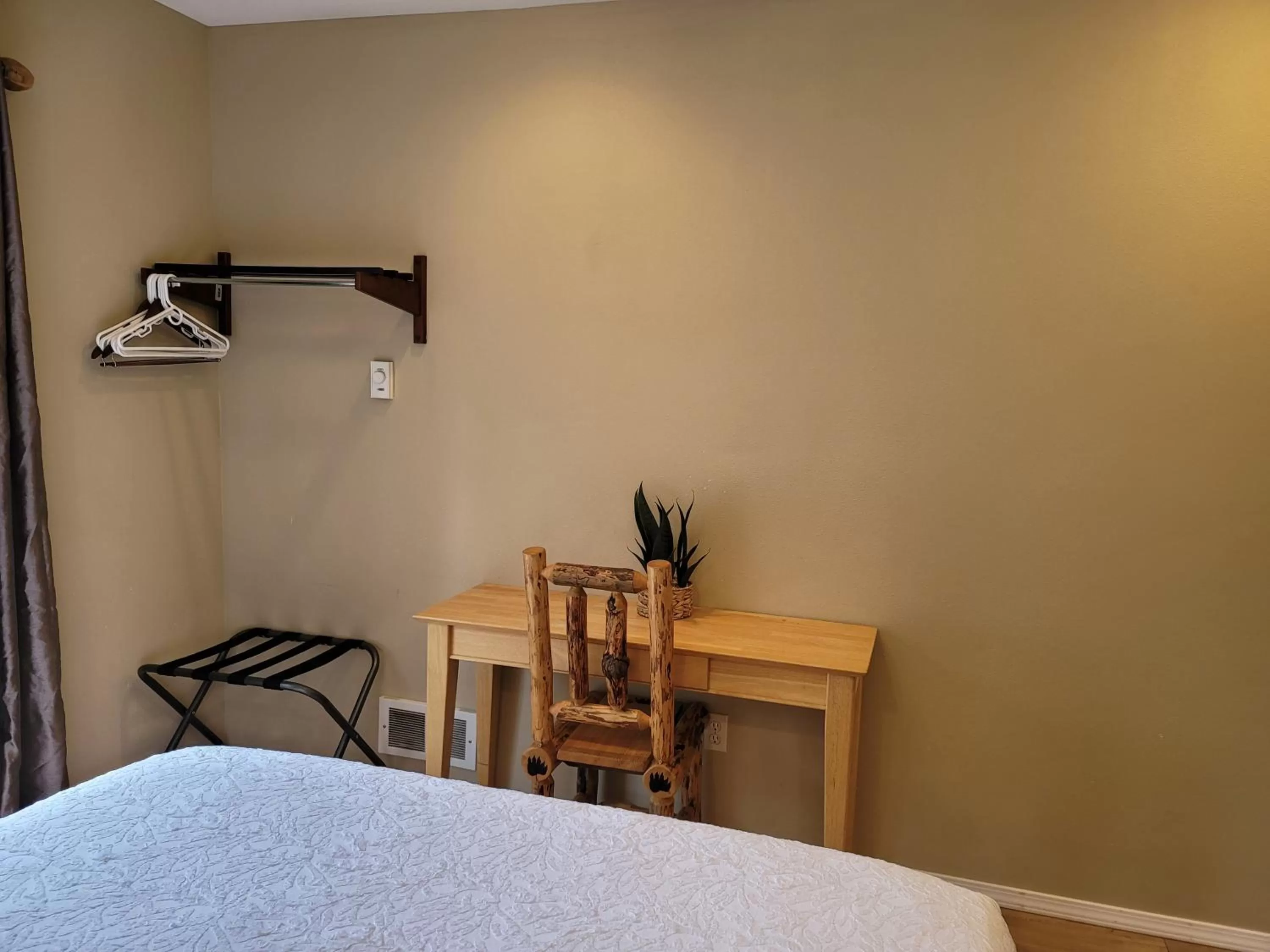 Bed in Riverfront Motel & Cabins