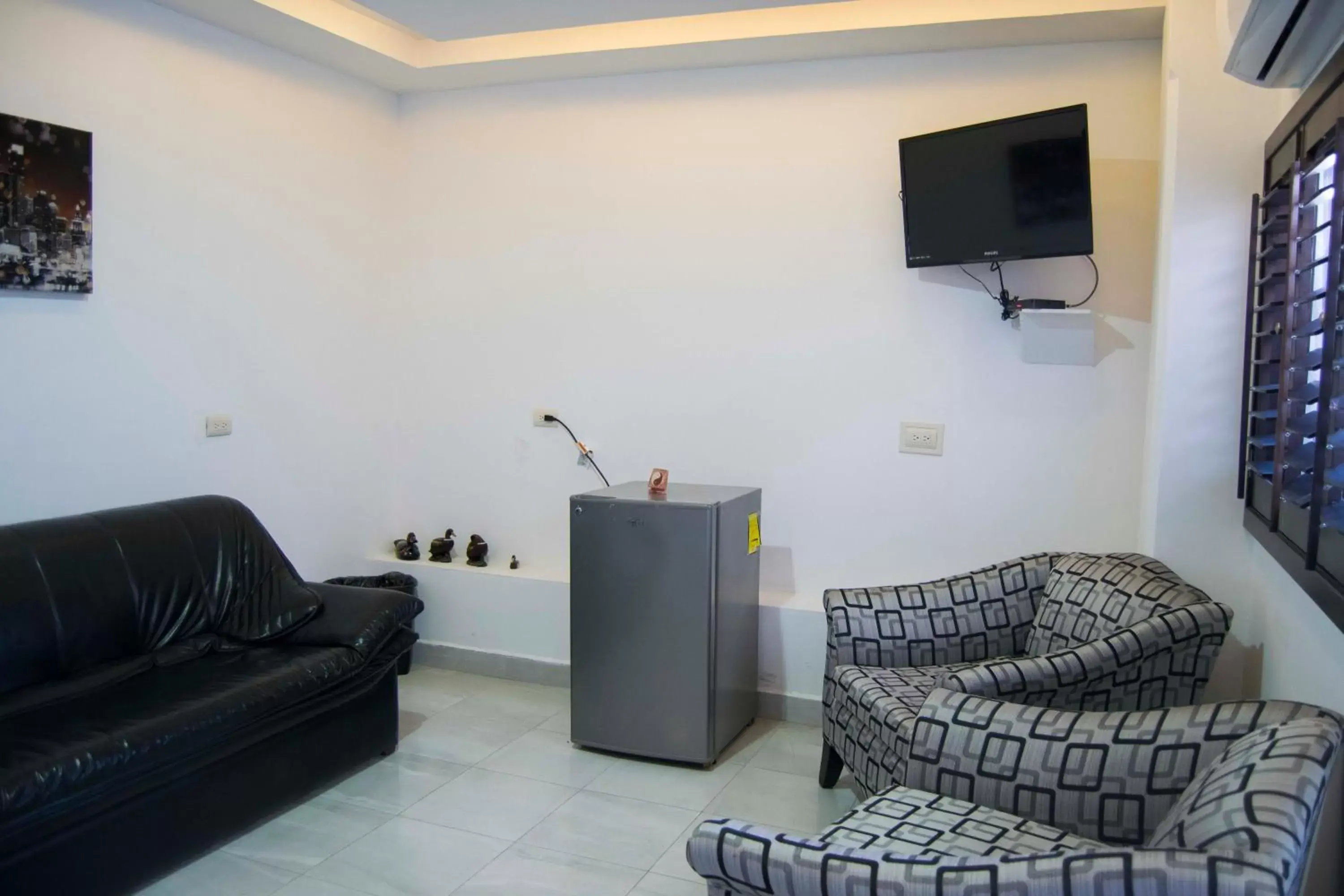 Communal lounge/ TV room, Seating Area in Hotel Onix Suites