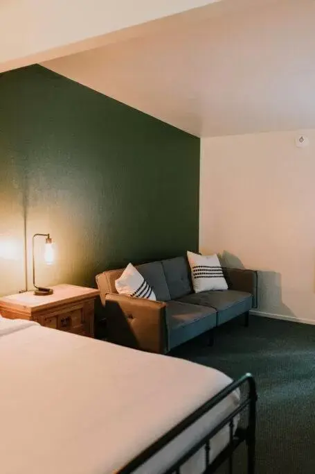 Living room, Bed in The Long Barn Lodge