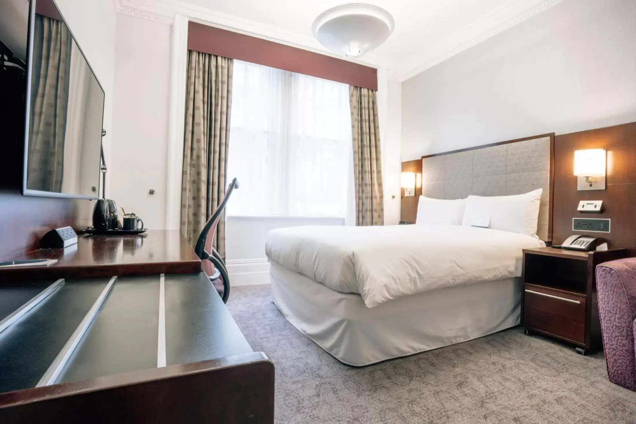 Bed in Club Quarters Hotel Trafalgar Square, London