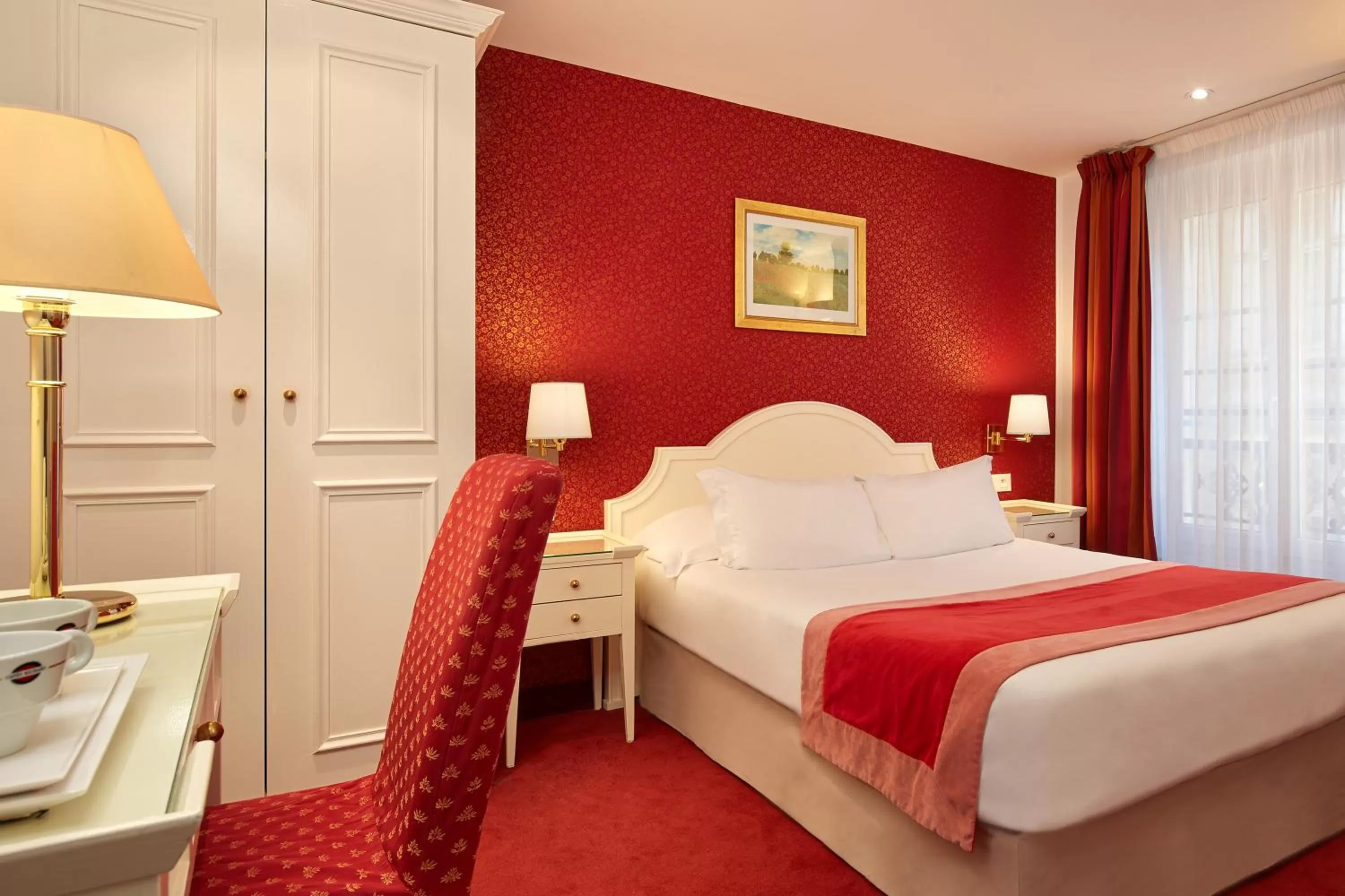 Bed in Austin's Arts Et Metiers Hotel