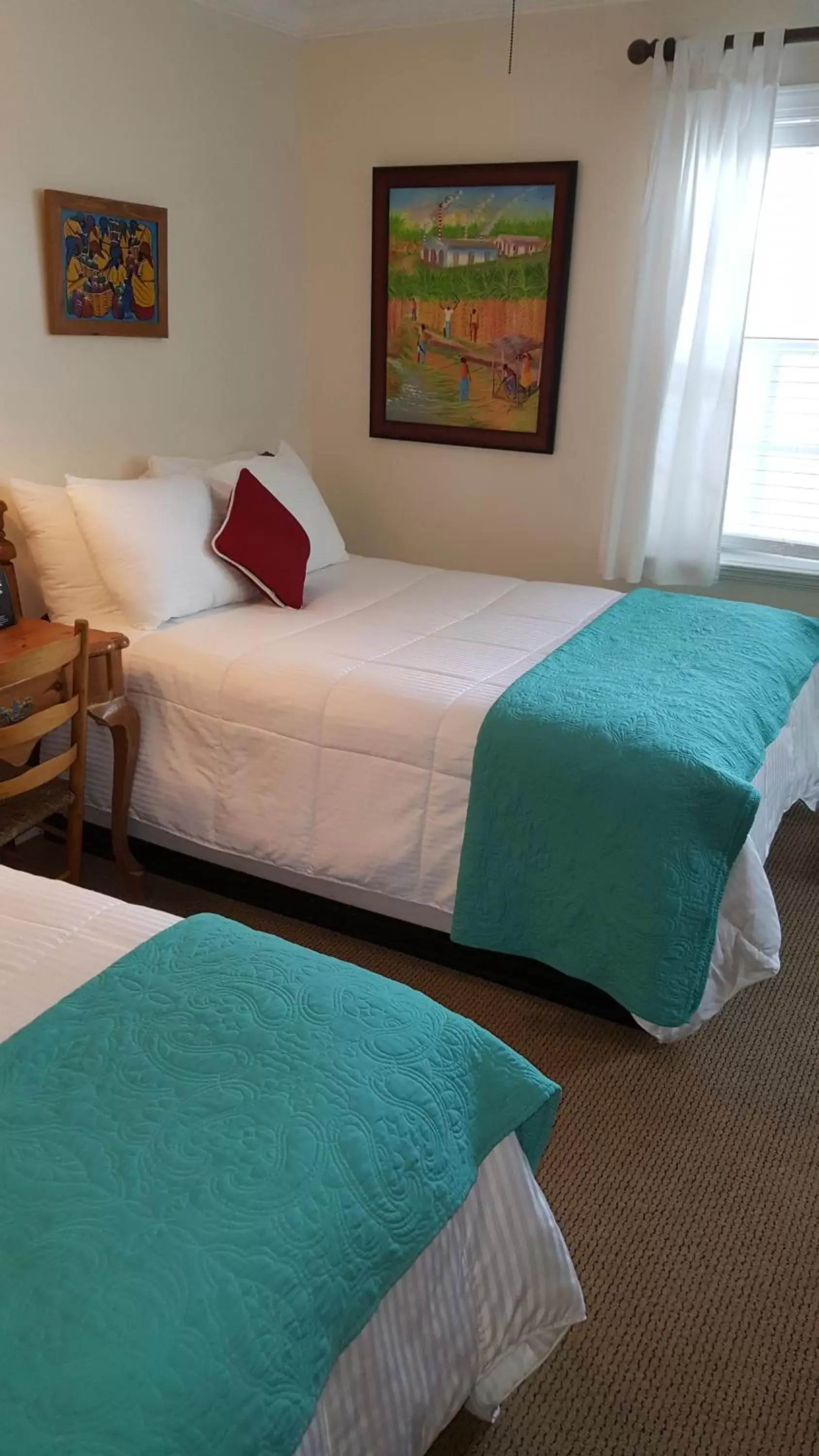 Bedroom, Bed in The Caribbean Court Boutique Hotel