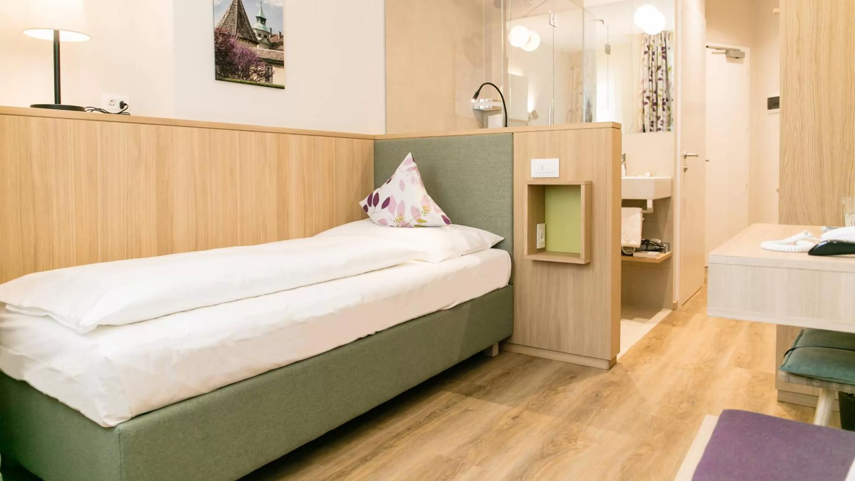 Bed in Flora Hotel & Suites