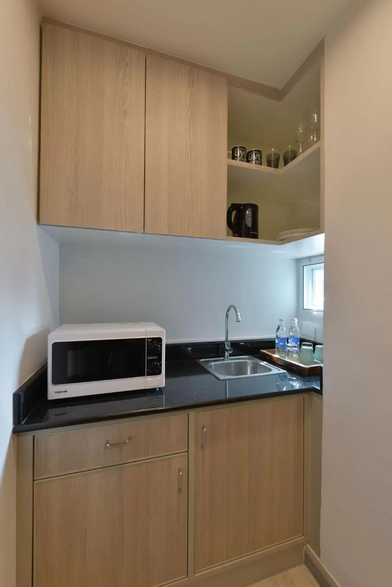Kitchen/Kitchenette in Aspira Residence Ruamrudee
