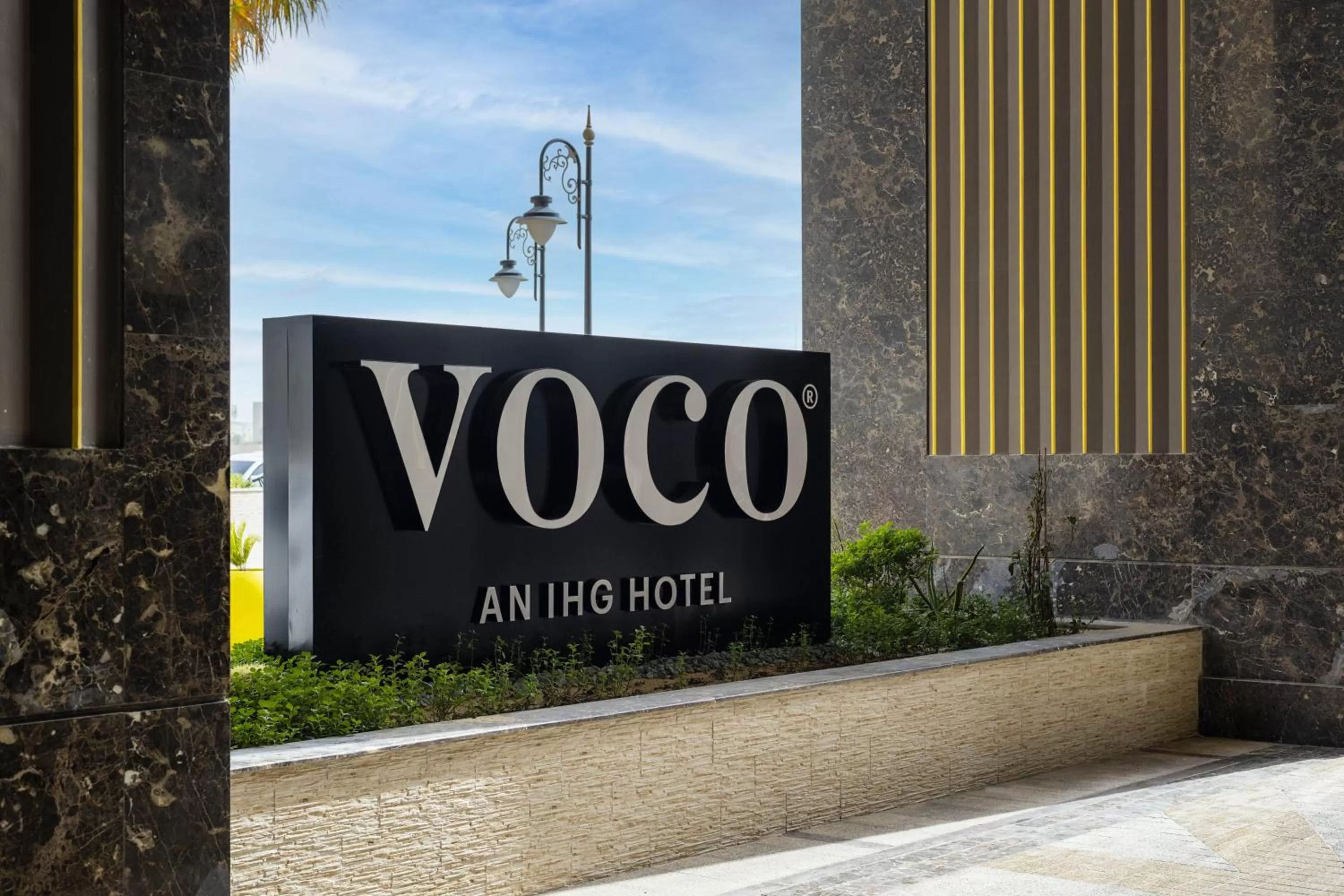 Property logo or sign in voco Doha West Bay Suites by IHG