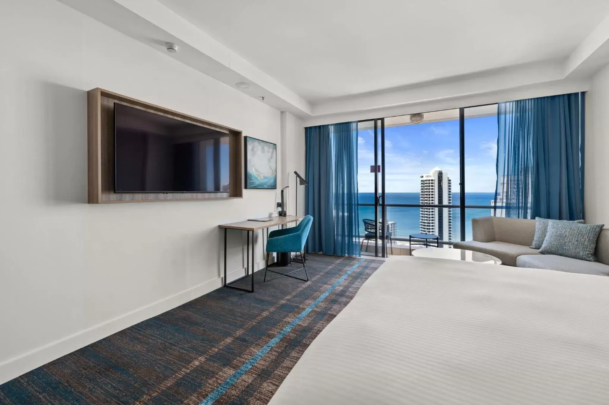 Photo of the whole room, TV/Entertainment Center in Crowne Plaza Surfers Paradise, an IHG Hotel