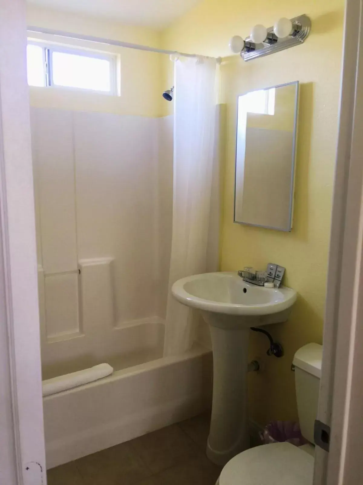 Toilet, Bathroom in Europa Inn & Suites