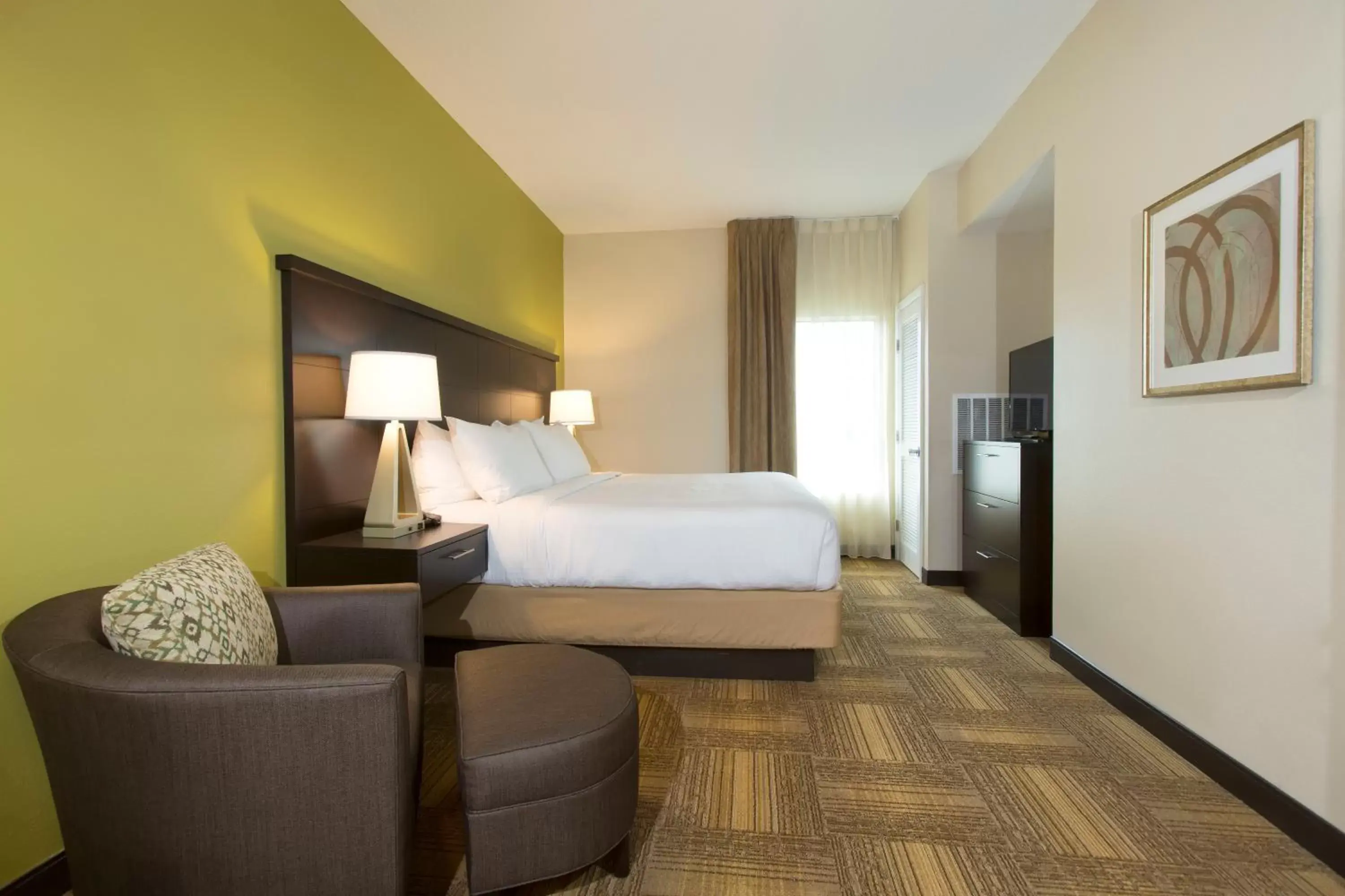 Bedroom in Staybridge Suites Orlando at SeaWorld, an IHG Hotel