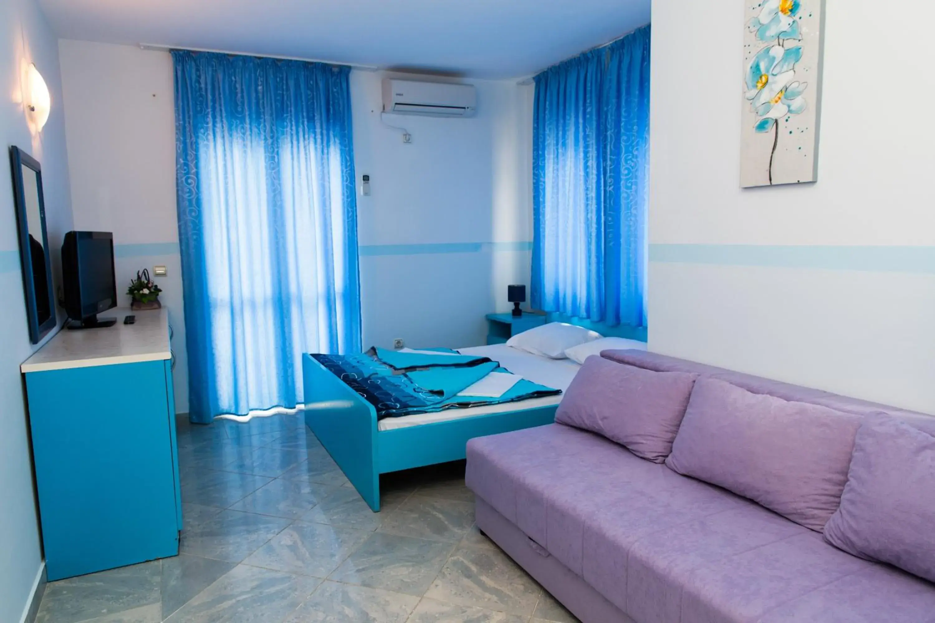 Bed, Seating Area in Hotel Obala