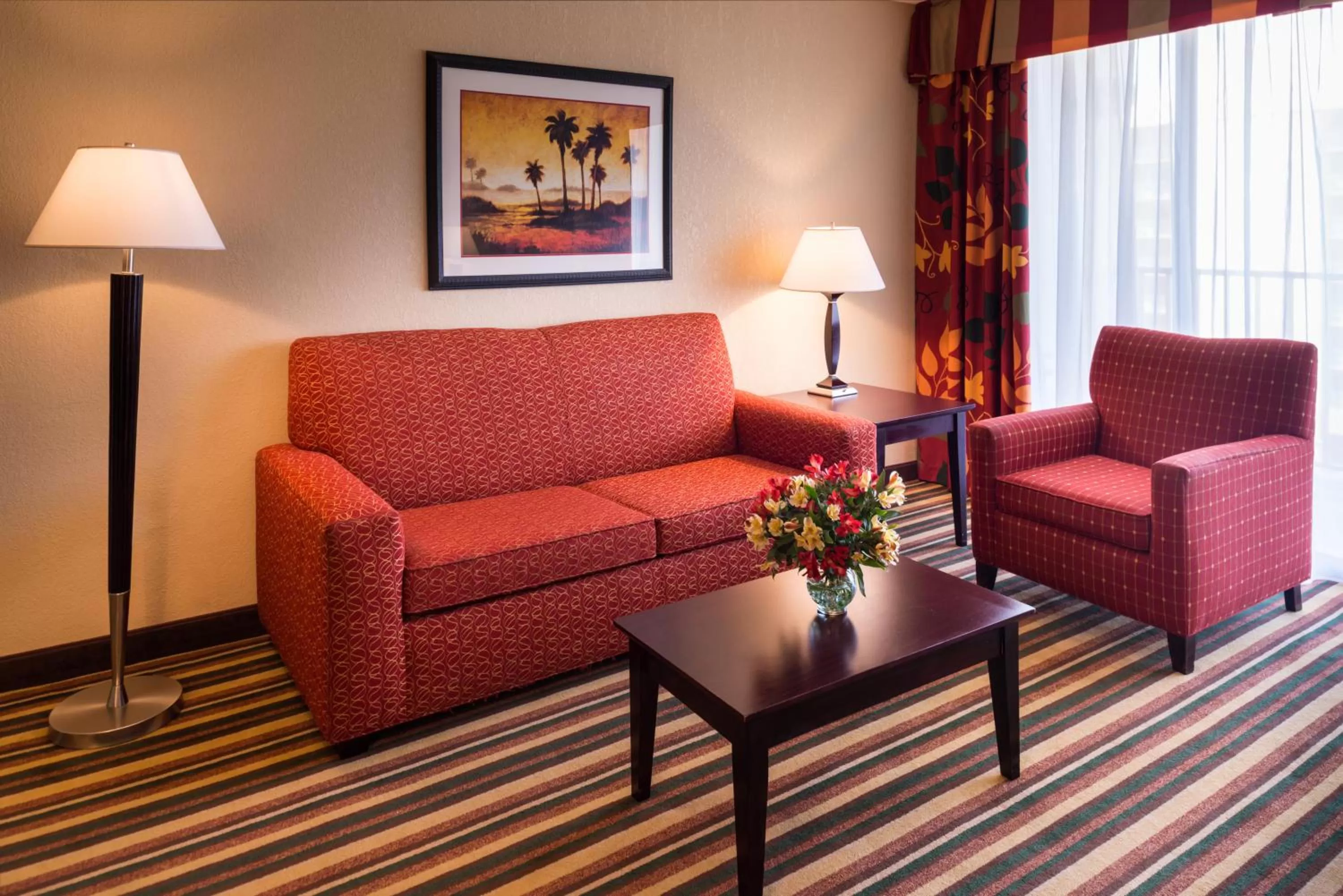 Living room in Holiday Inn & Suites Orlando SW - Celebration Area by IHG