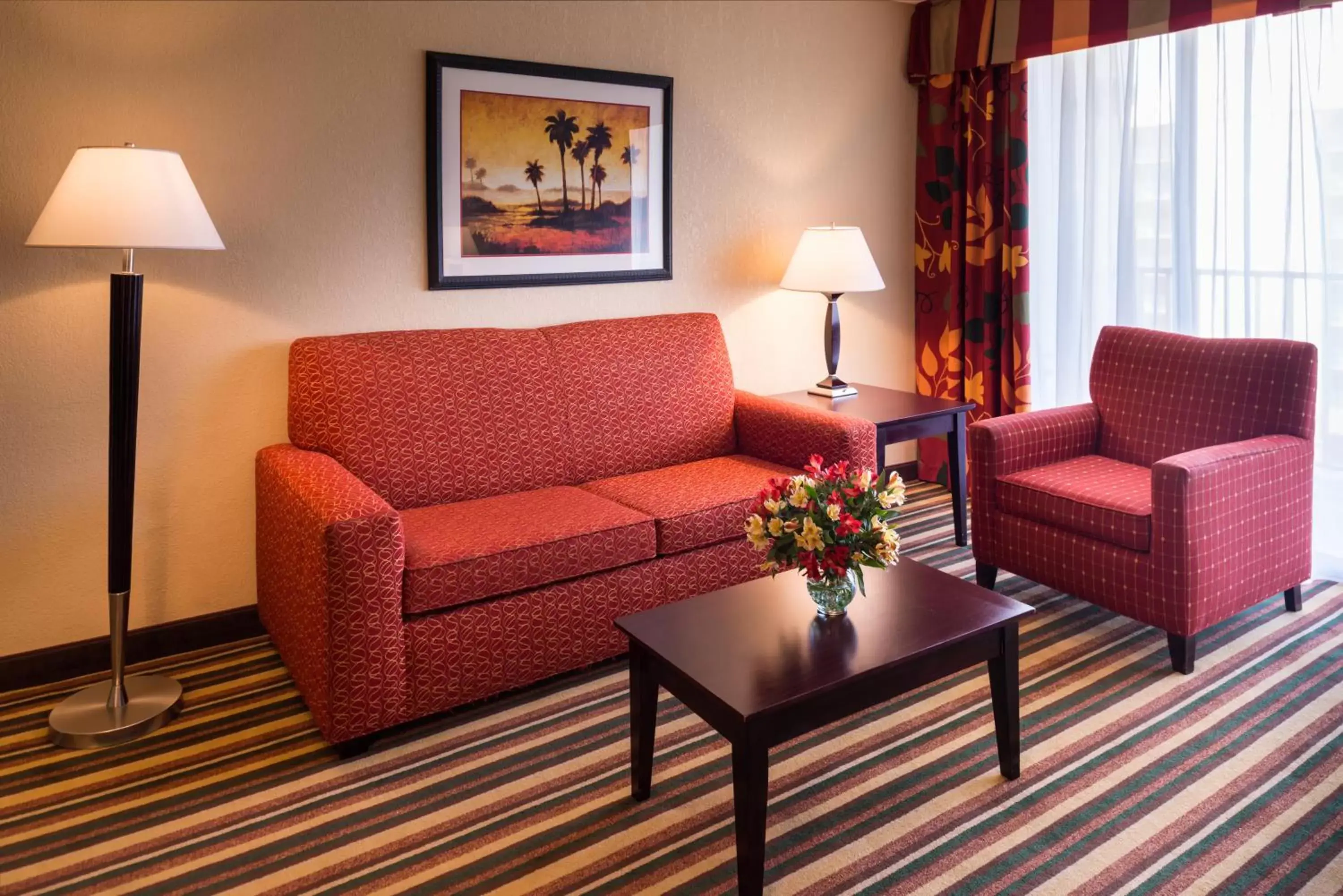 Living room, Seating Area in Holiday Inn & Suites Orlando SW - Celebration Area, an IHG Hotel