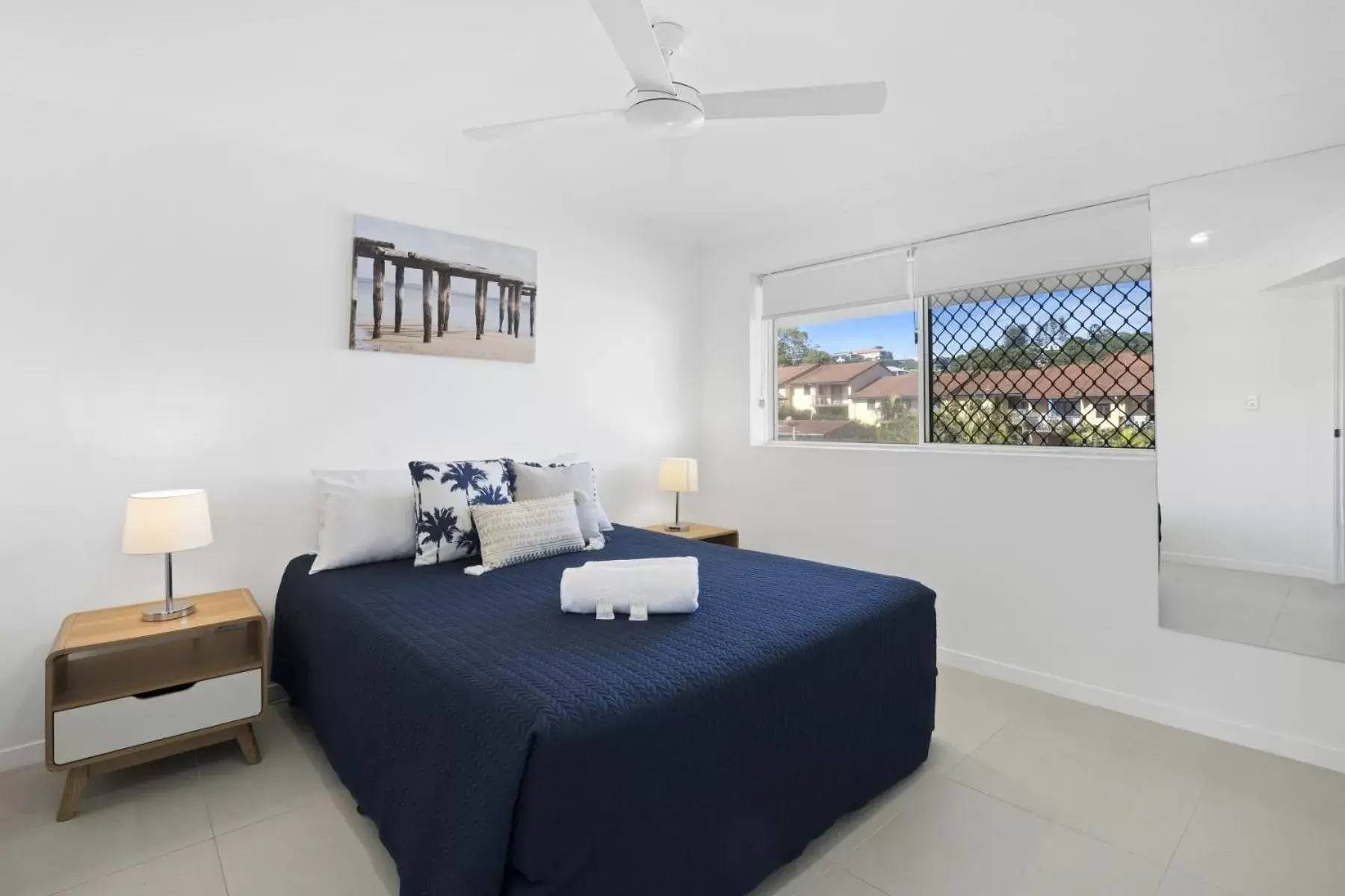 Bed in Kirra Palms Holiday Apartments