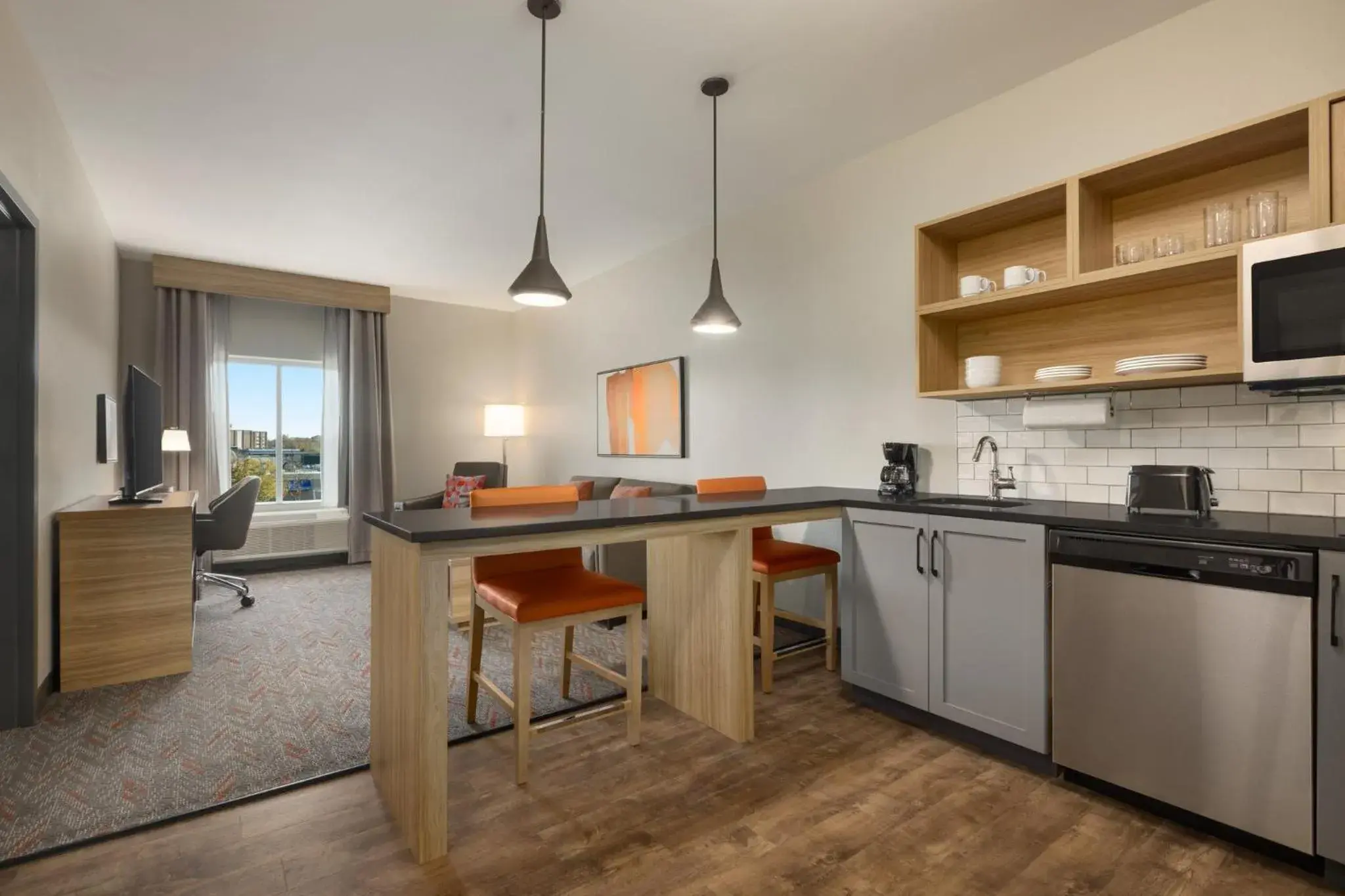 Photo of the whole room, Kitchen/Kitchenette in Candlewood Suites McPherson, an IHG Hotel