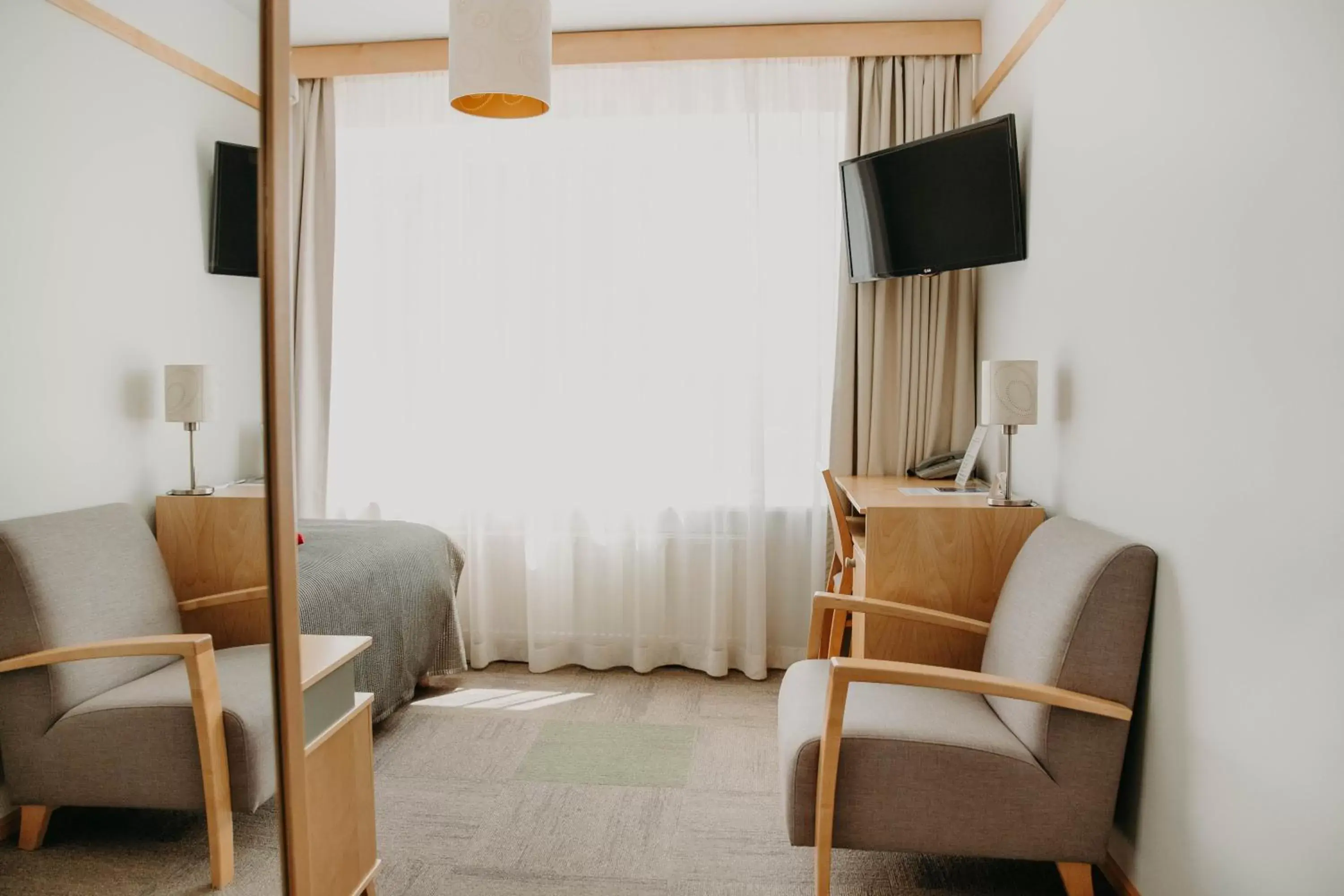 Bed, Seating Area in Hotel Tartu