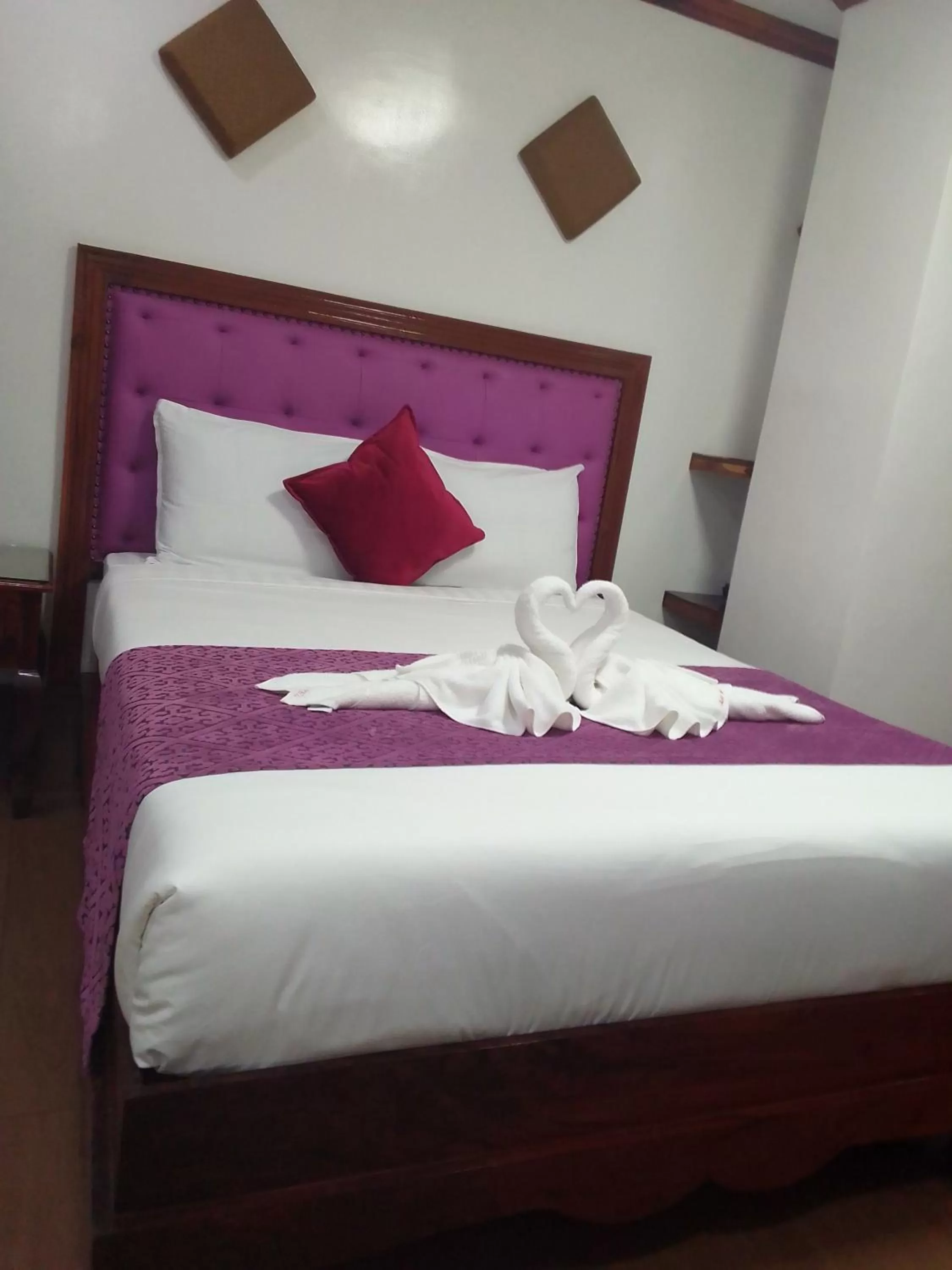 Bed in CLN Boutique Hotel