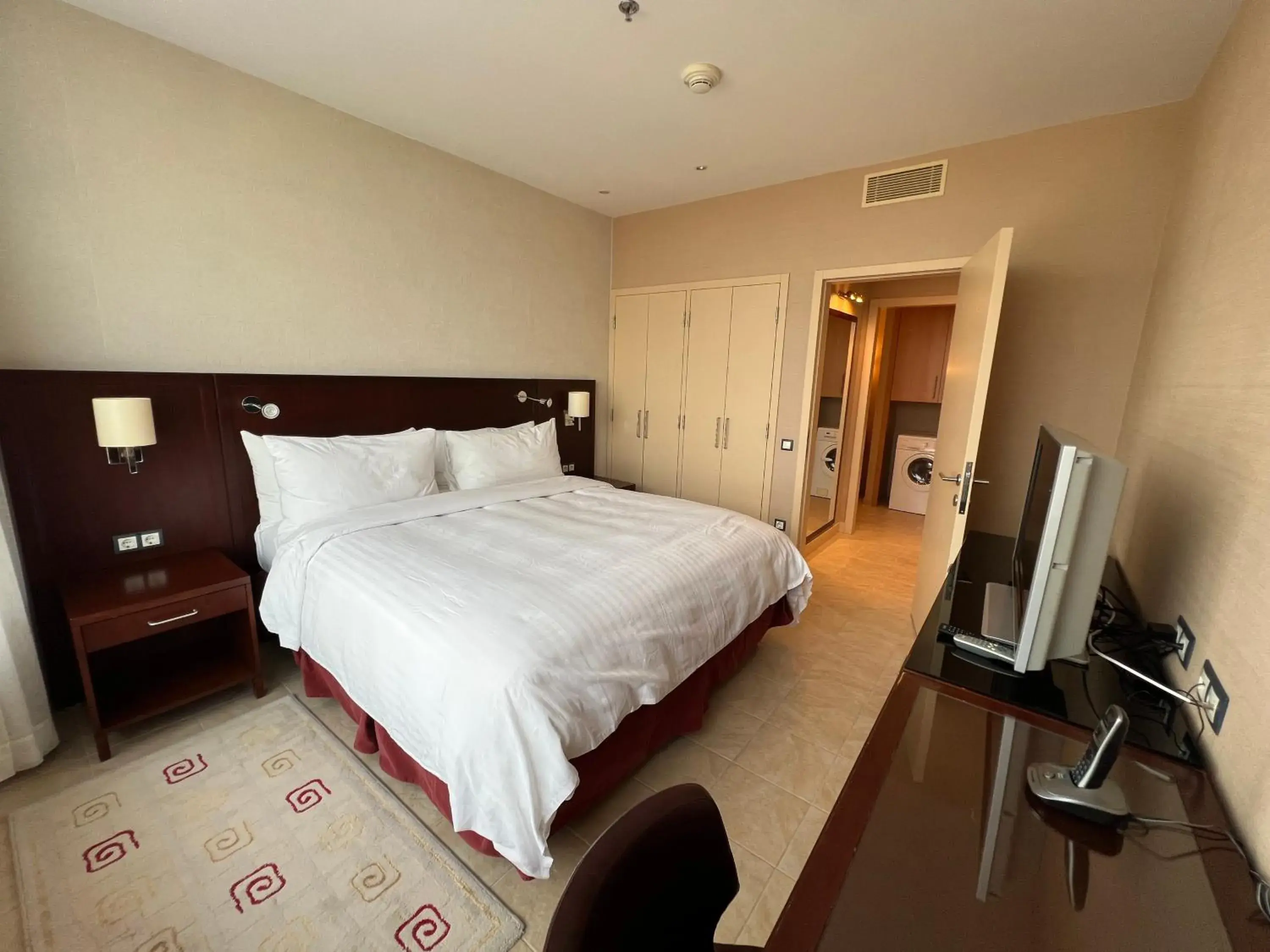 Property building, Bed in Marriott Executive Apartments Atyrau