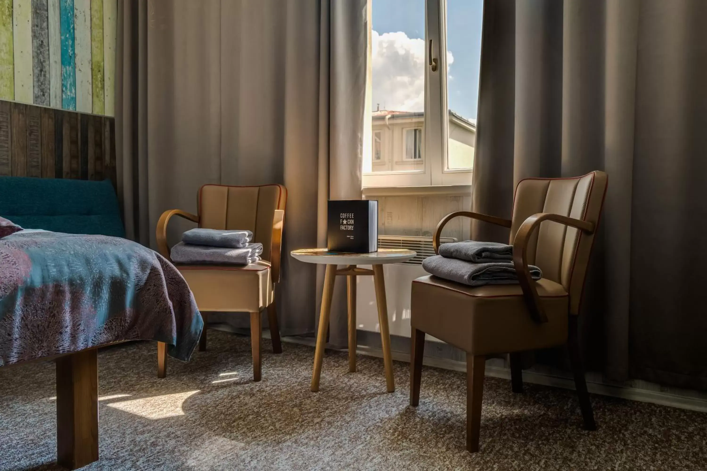 Bedroom, Seating Area in Royal Court Hotel