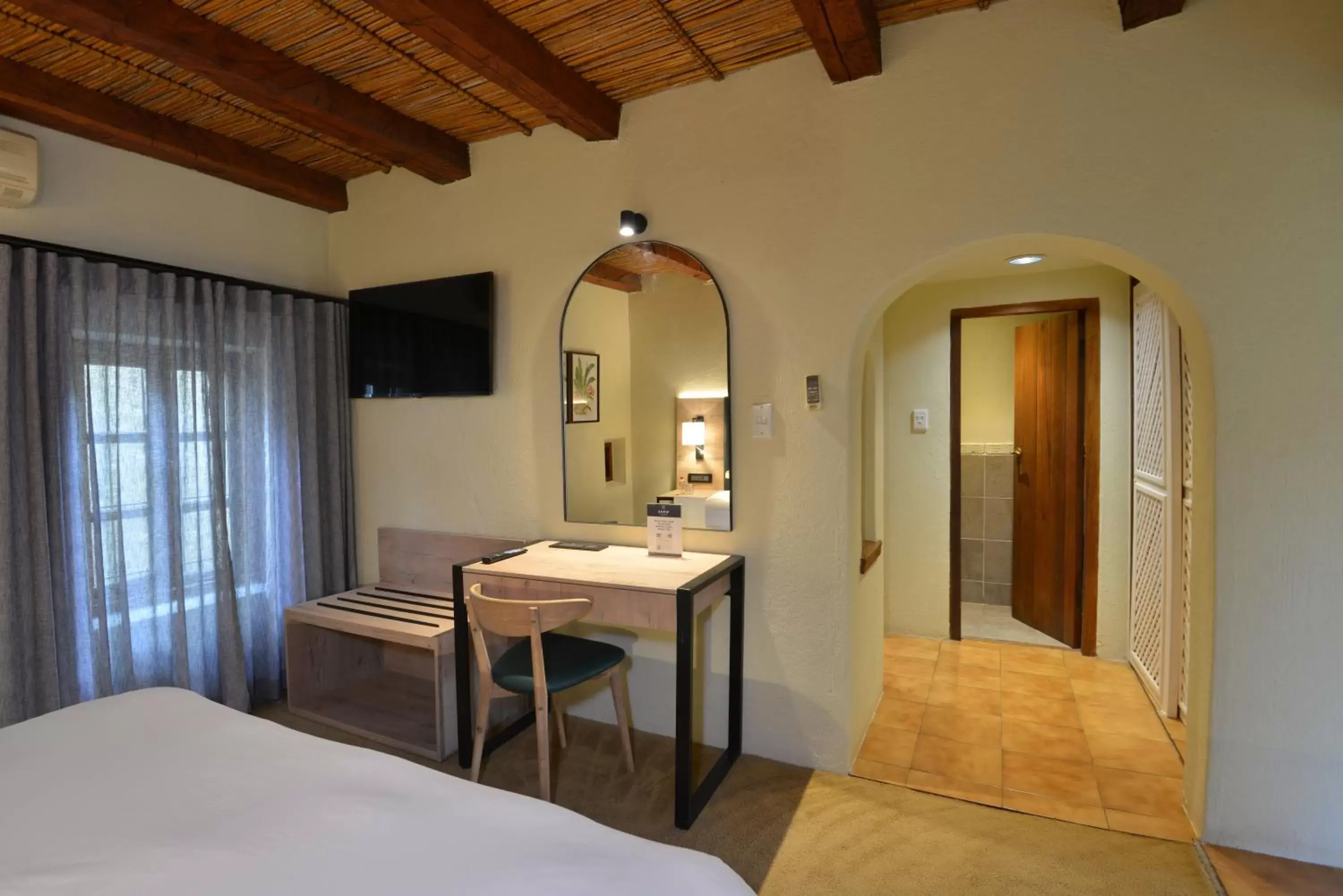 Bed, TV/Entertainment Center in ANEW Resort Hazyview Kruger Park